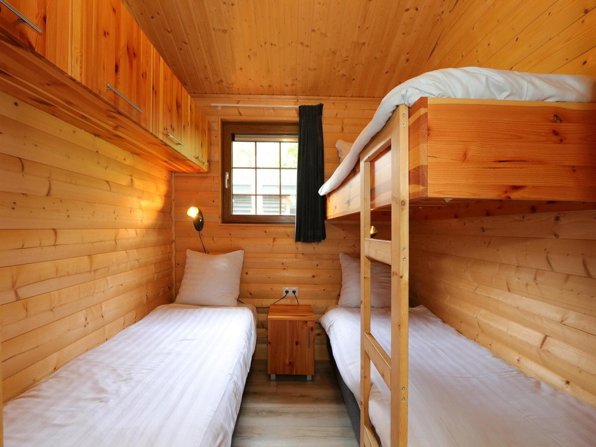 Een slaapkamer van Boekhorst 5 in Otterlo