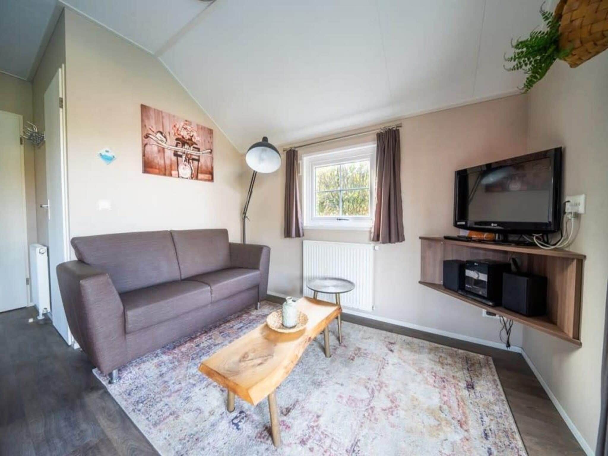 De woonkamer van Boslodge 4 in Otterlo