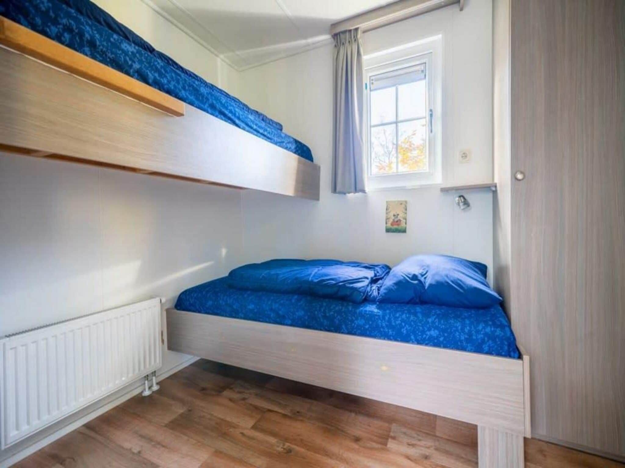 Een slaapkamer van Mobilehome 4 in Otterlo