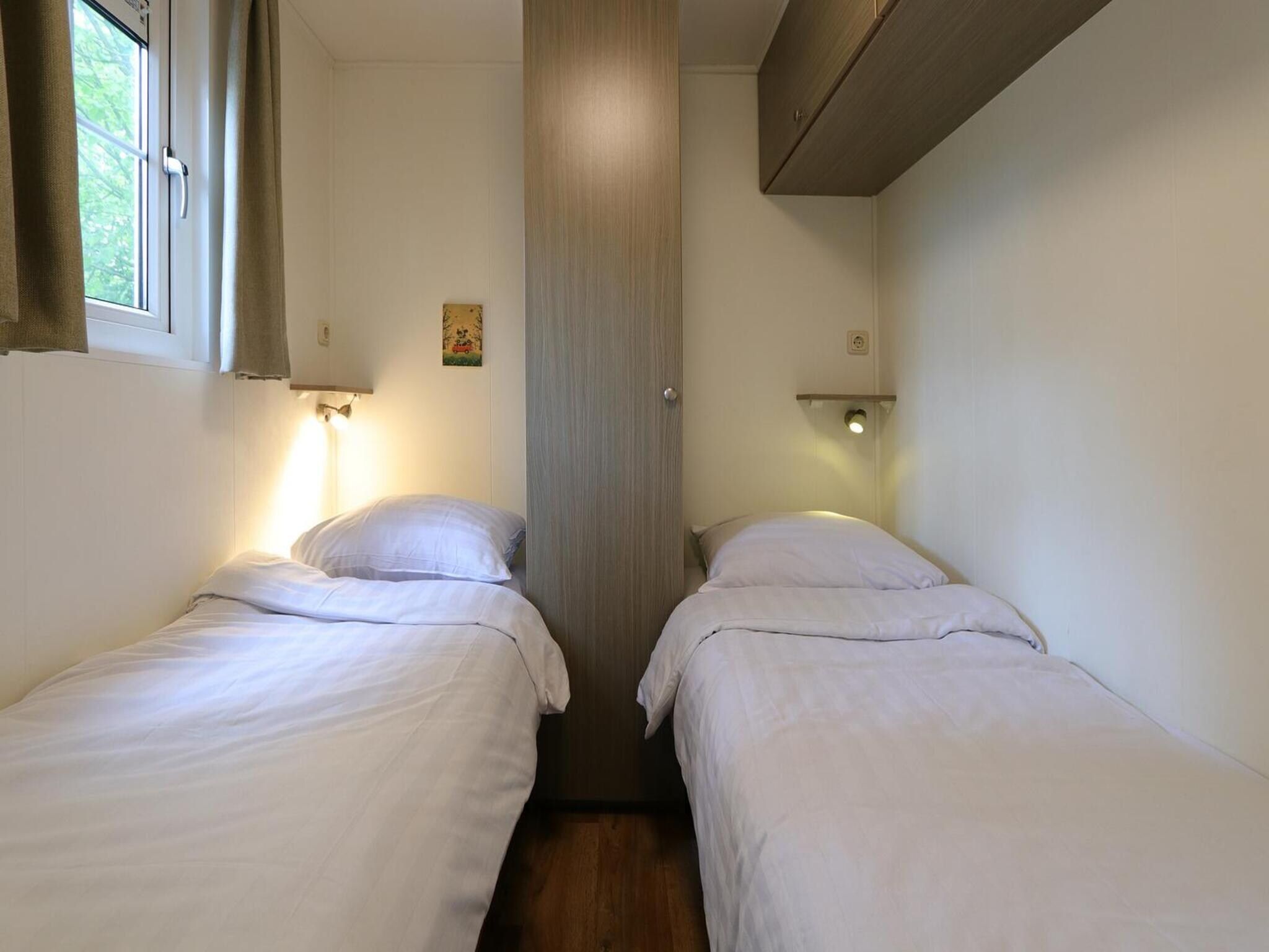 Een slaapkamer van Mobilehome 6 in Otterlo