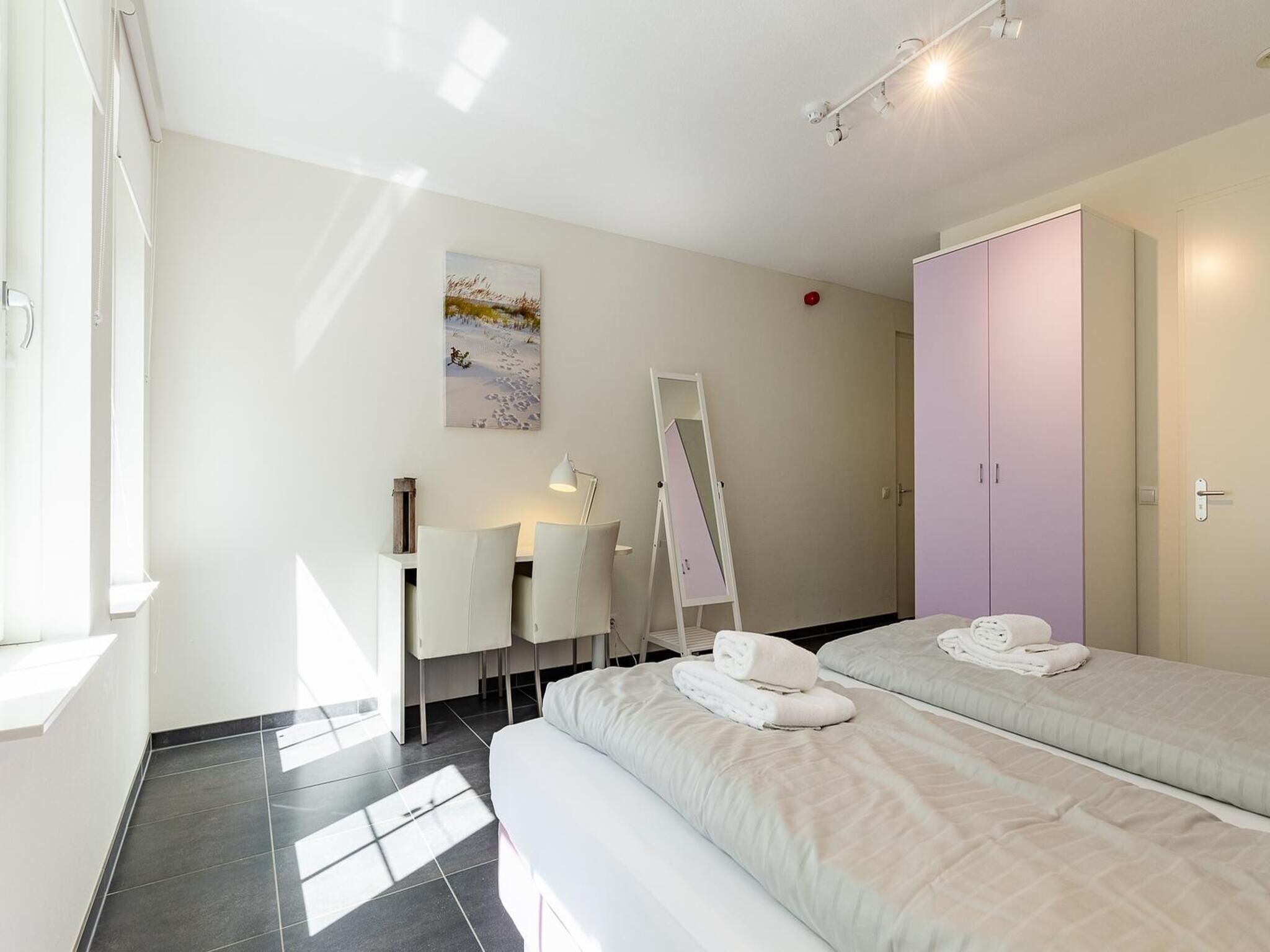 Een slaapkamer van Appartement Duinhof Dishoek 13H - 6 pers de luxe in Koudekerke