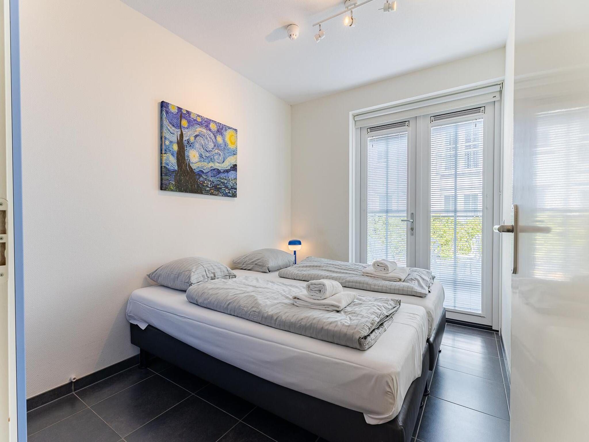Een slaapkamer van Appartement Duinhof Dishoek 13H - 6 pers de luxe in Koudekerke