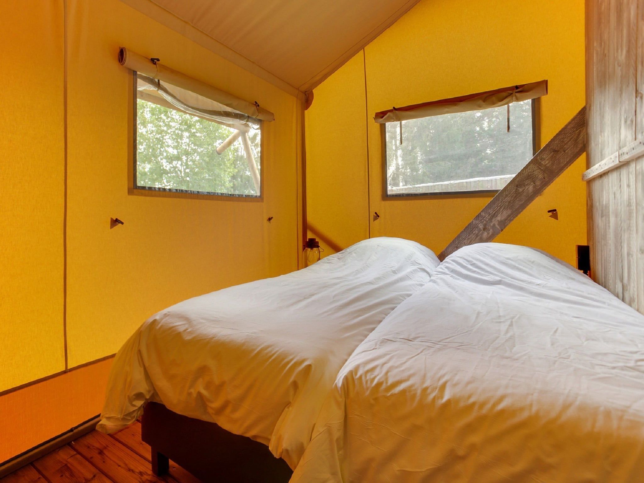Een slaapkamer van Vakantiepark Sandberghe 9 in Uden