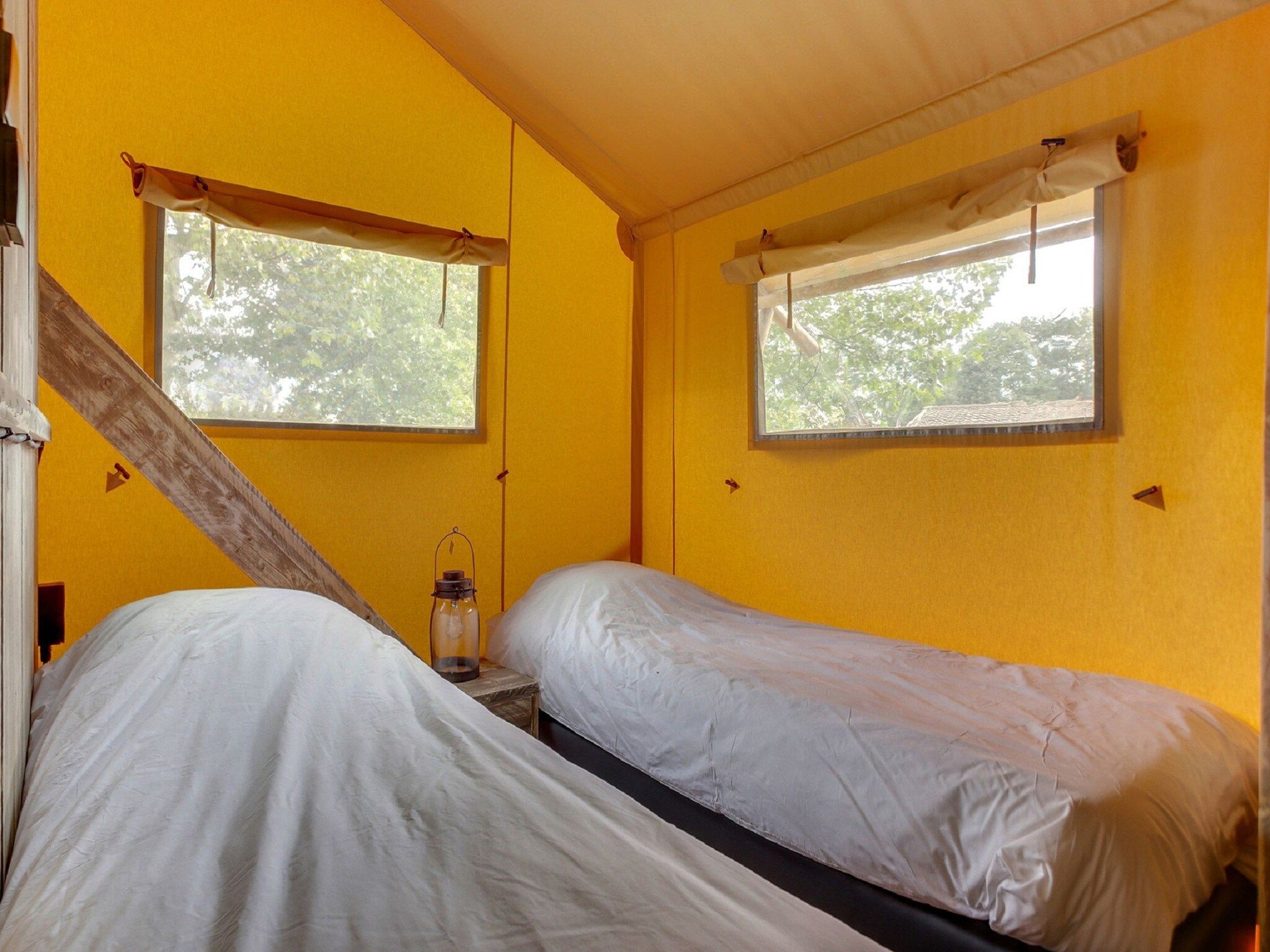 Een slaapkamer van Vakantiepark Sandberghe 11 in Uden
