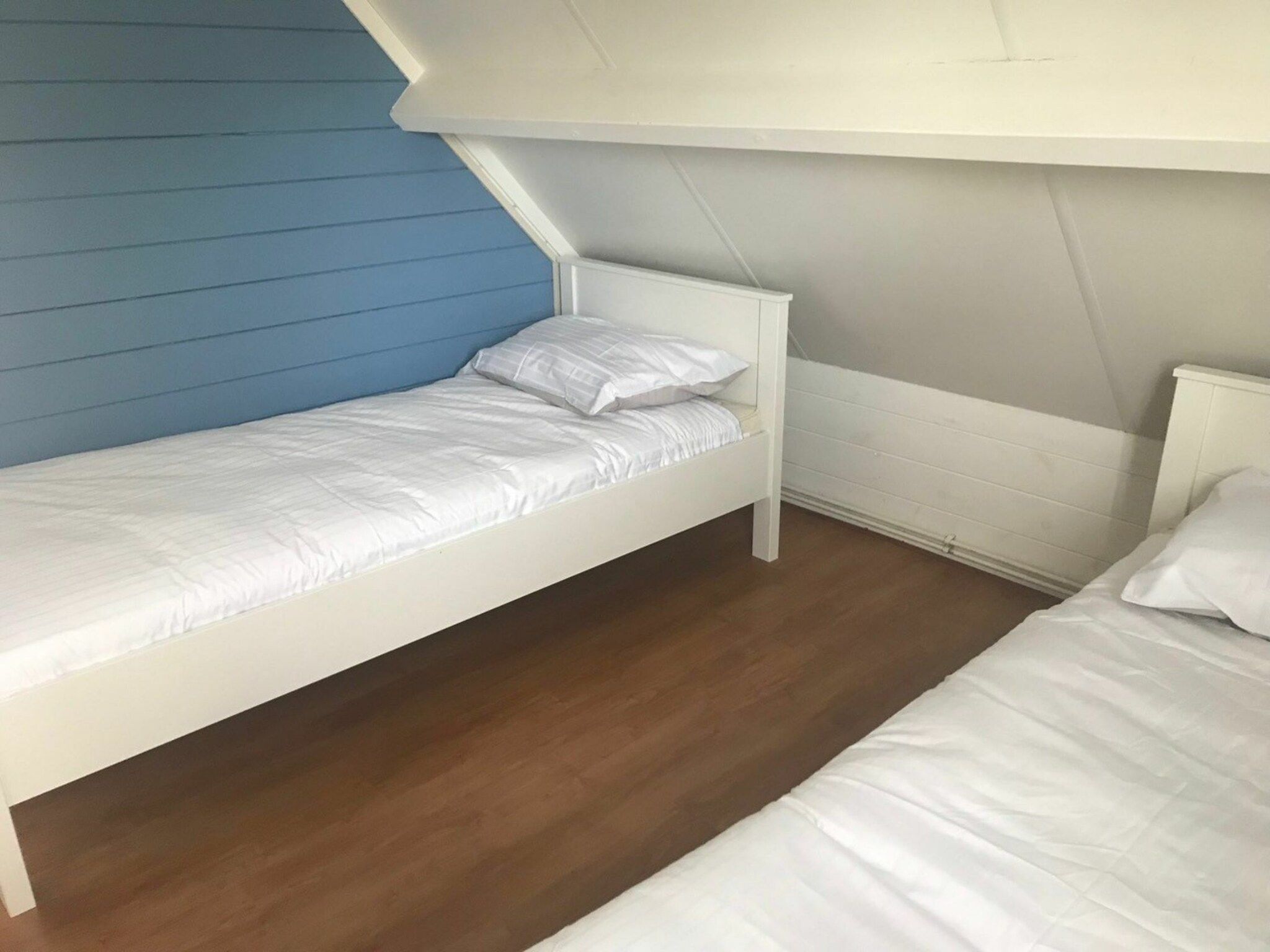 Een slaapkamer van Hoge Weide 64 in Oostkapelle
