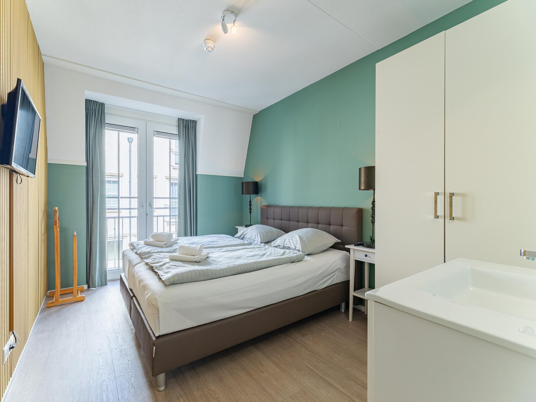 Een slaapkamer van Appartement Duinhof Dishoek 13M - 6 personen de luxe in Koudekerke