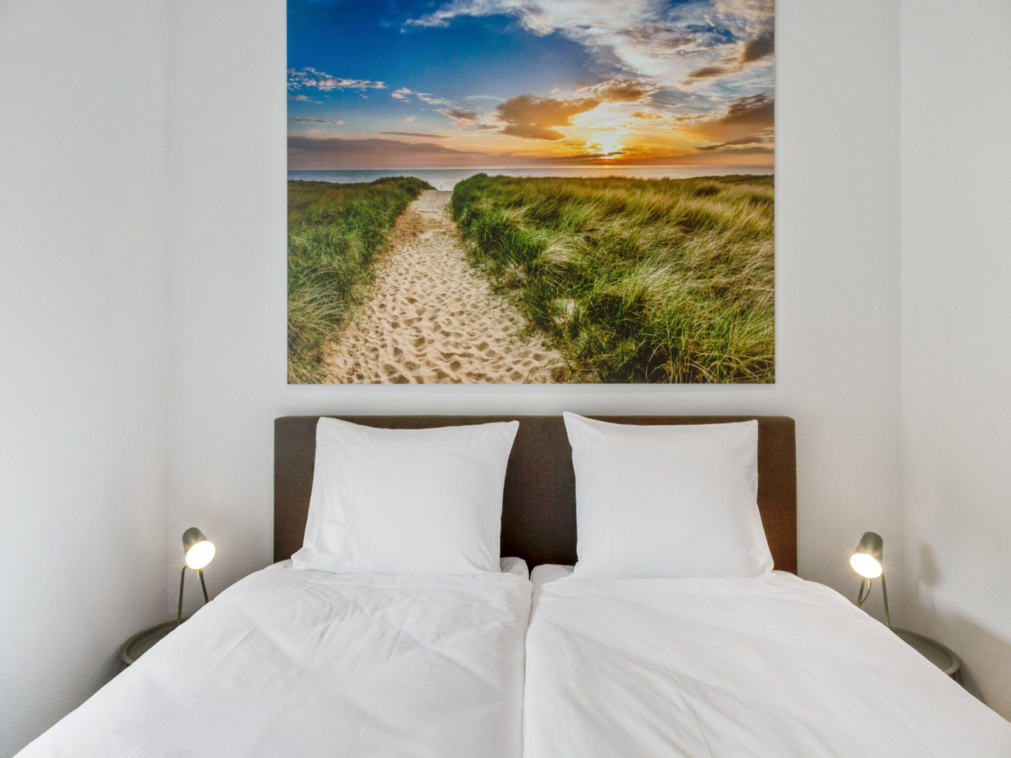 Een slaapkamer van De Koog nr 1 - 6 pers woning de luxe in De Koog Texel