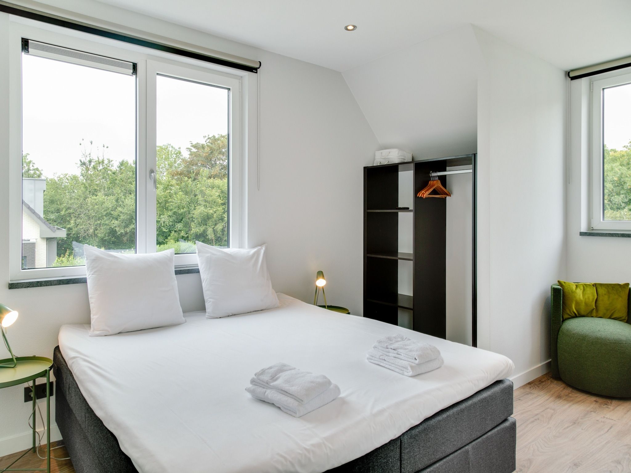 Een slaapkamer van De Koog nr 1 - 6 pers woning de luxe in De Koog Texel