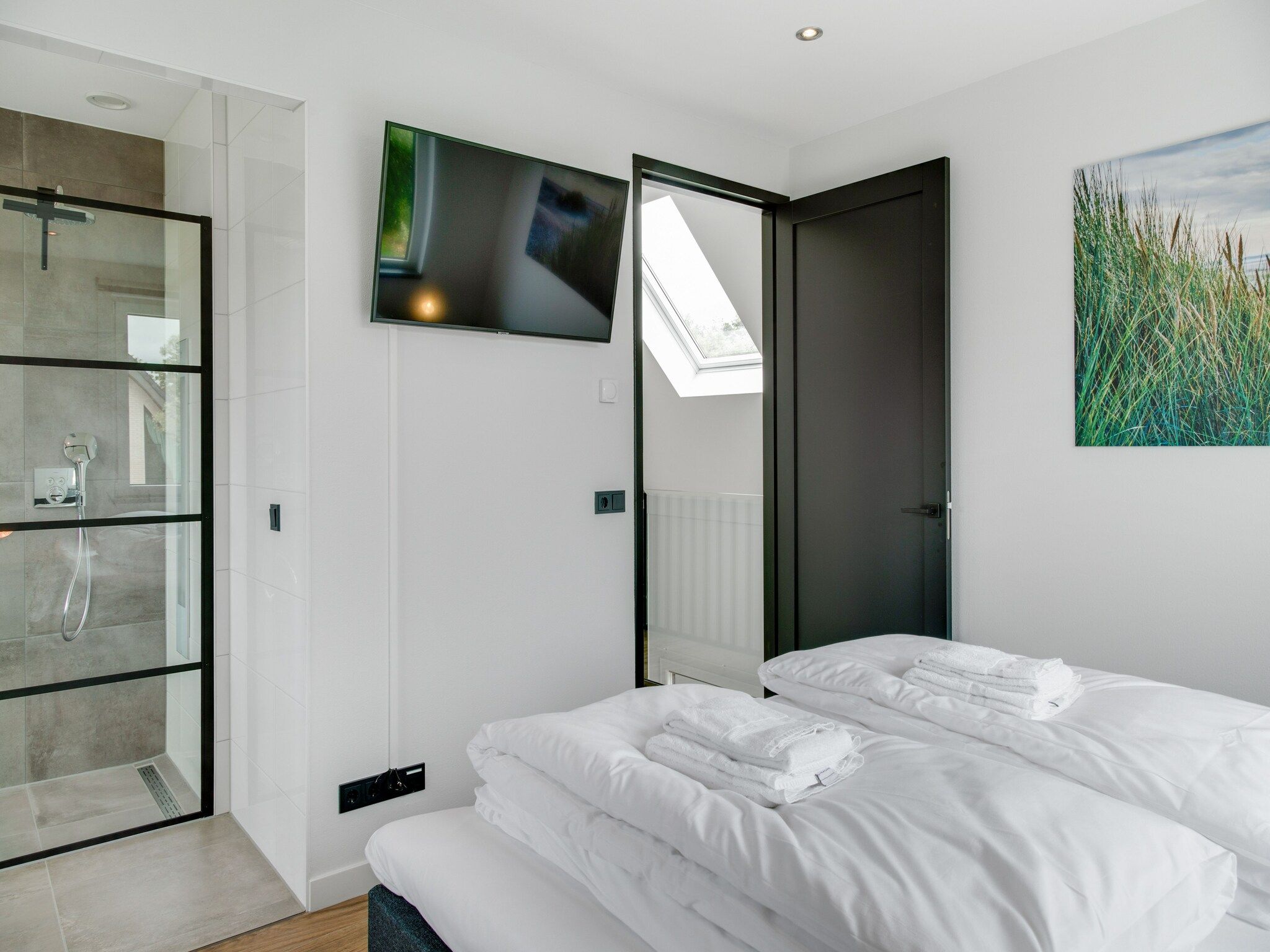 Een slaapkamer van De Koog nr 1 - 6 pers woning de luxe in De Koog Texel