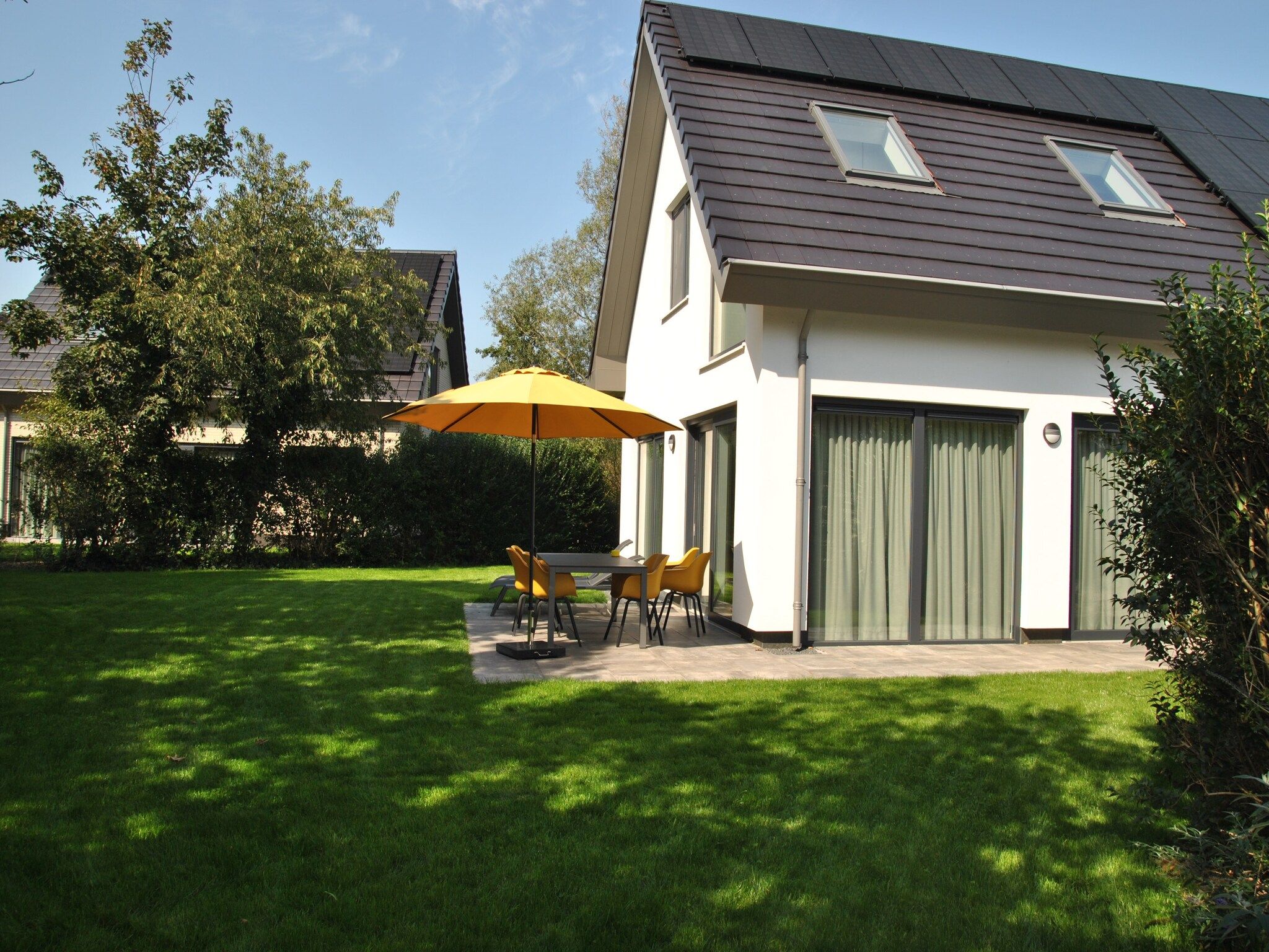 De tuin van De Koog nr 1 - 6 pers woning de luxe in De Koog Texel