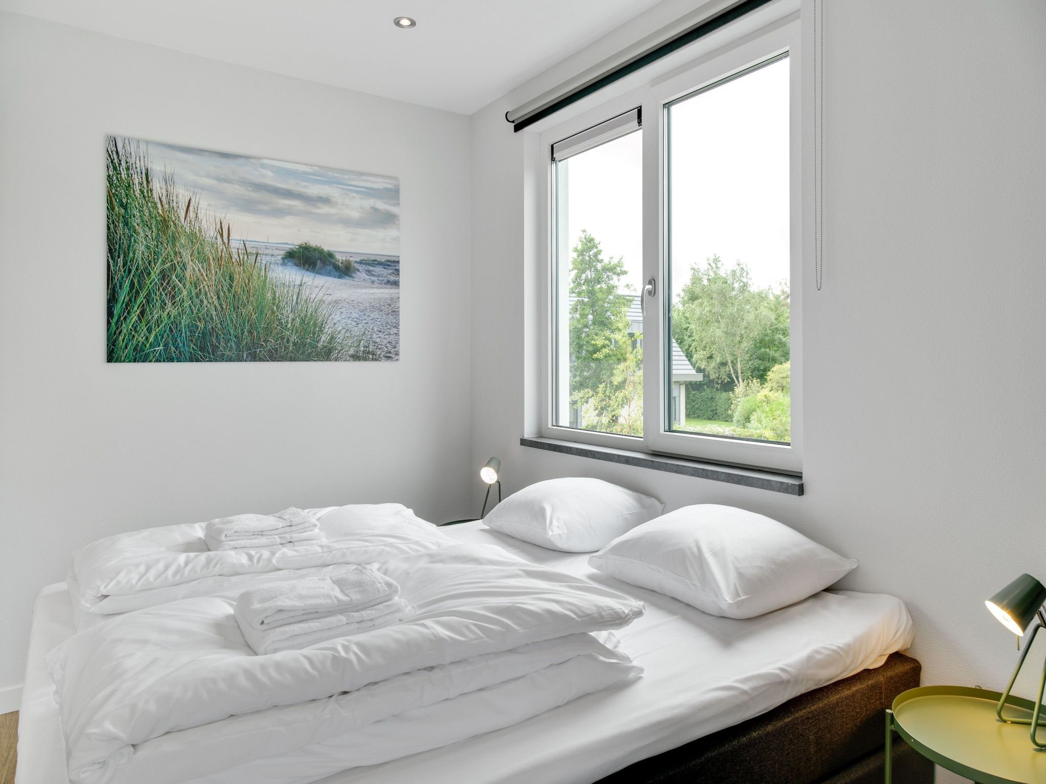 Een slaapkamer van De Koog  nr 4 - 6 pers woning de luxe in De Koog Texel