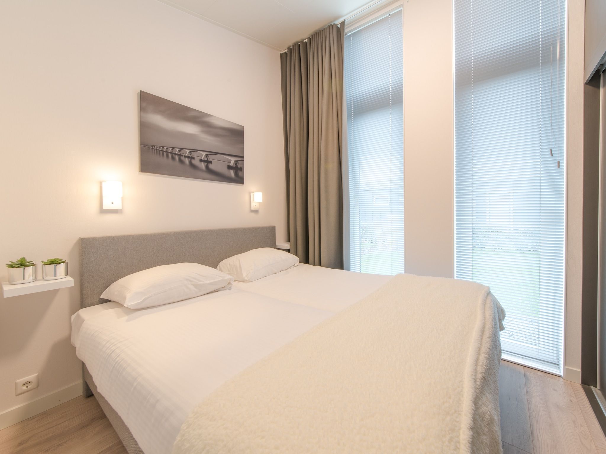 Een slaapkamer van Water Resort Oosterschelde 39 in Wemeldinge