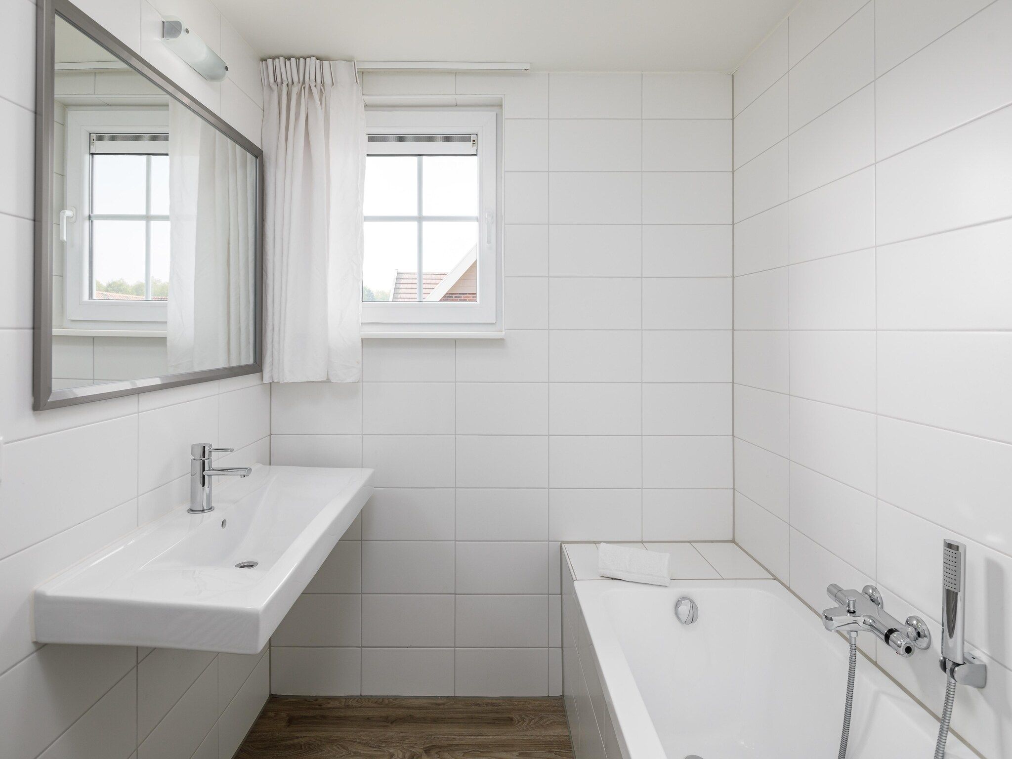 De badkamer van Résidence Klein Vink 7 in Arcen