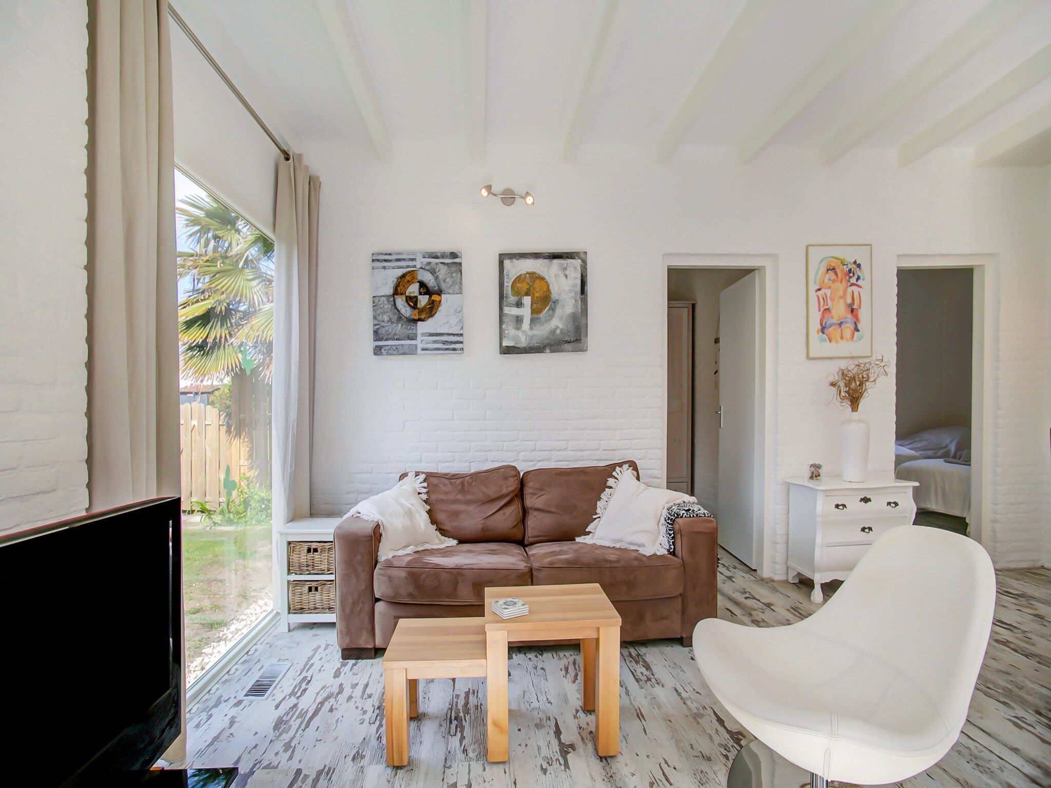 De woonkamer van Royal Palm in Noordwijkerhout