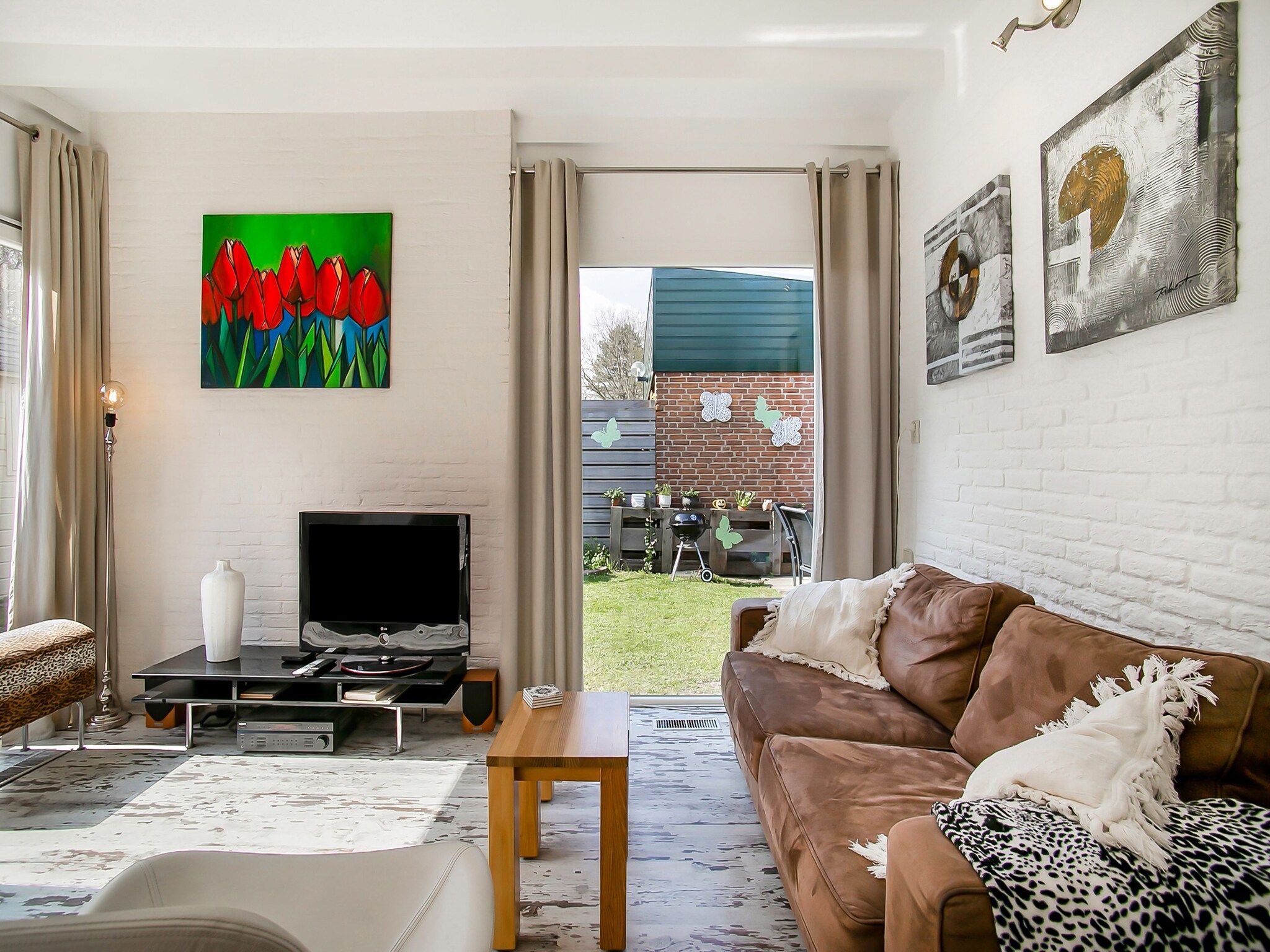 De woonkamer van Royal Palm in Noordwijkerhout