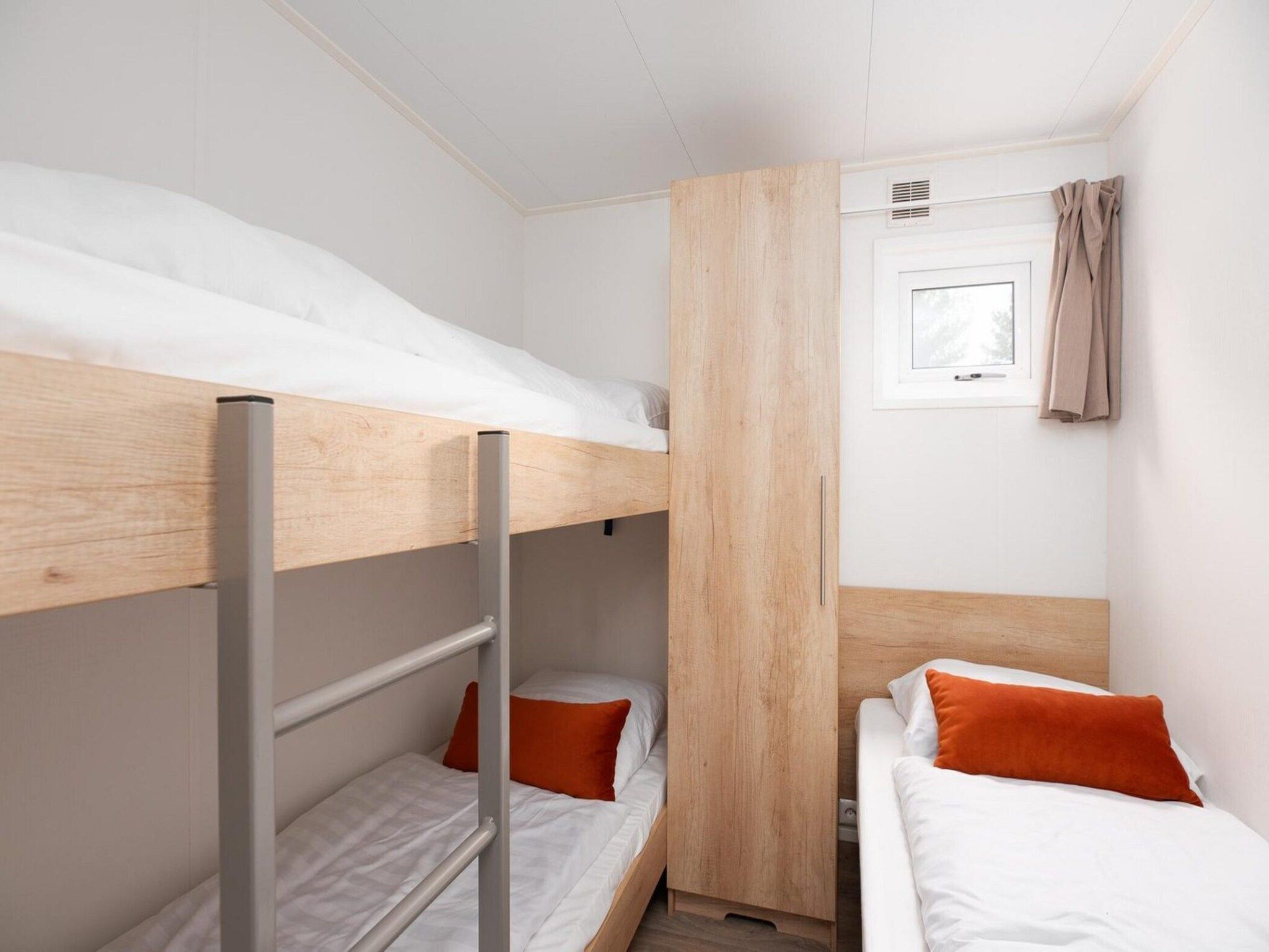 Een slaapkamer van Vakantiepark Mölke 23 in Zuna