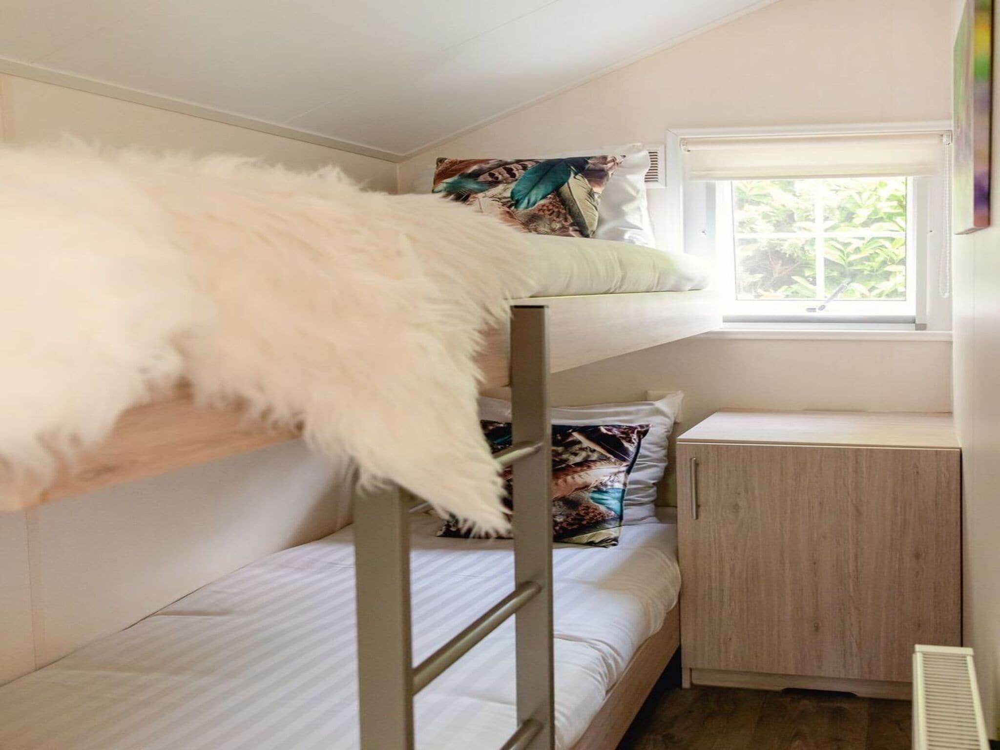 Een slaapkamer van Vakantiepark Mölke 24 in Zuna