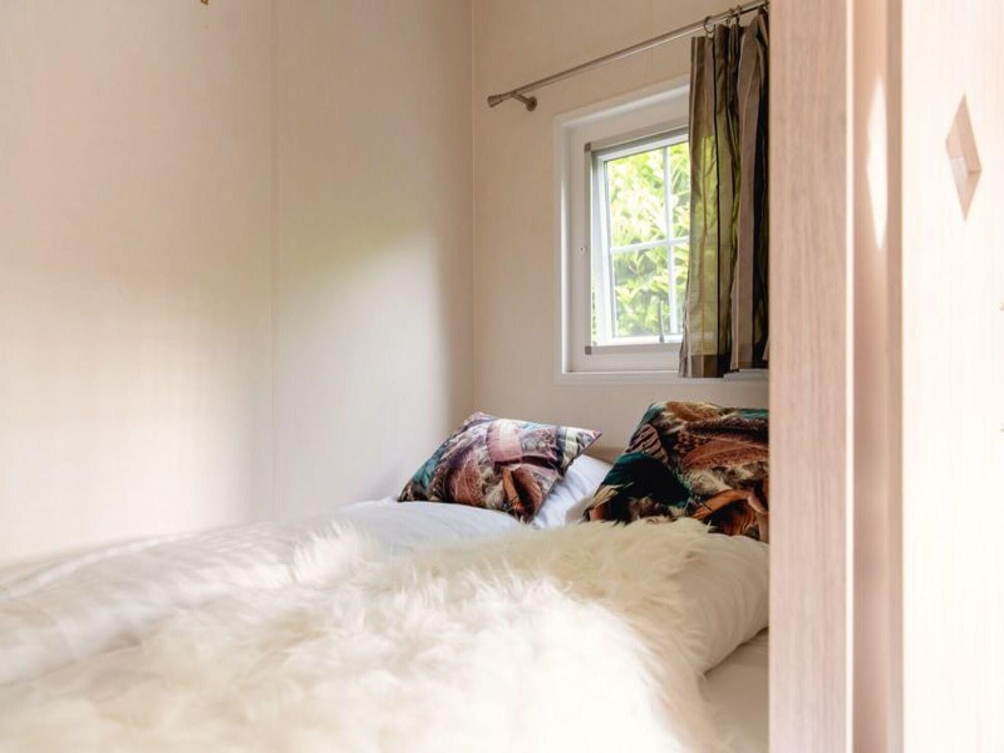 Een slaapkamer van Vakantiepark Mölke 24 in Zuna
