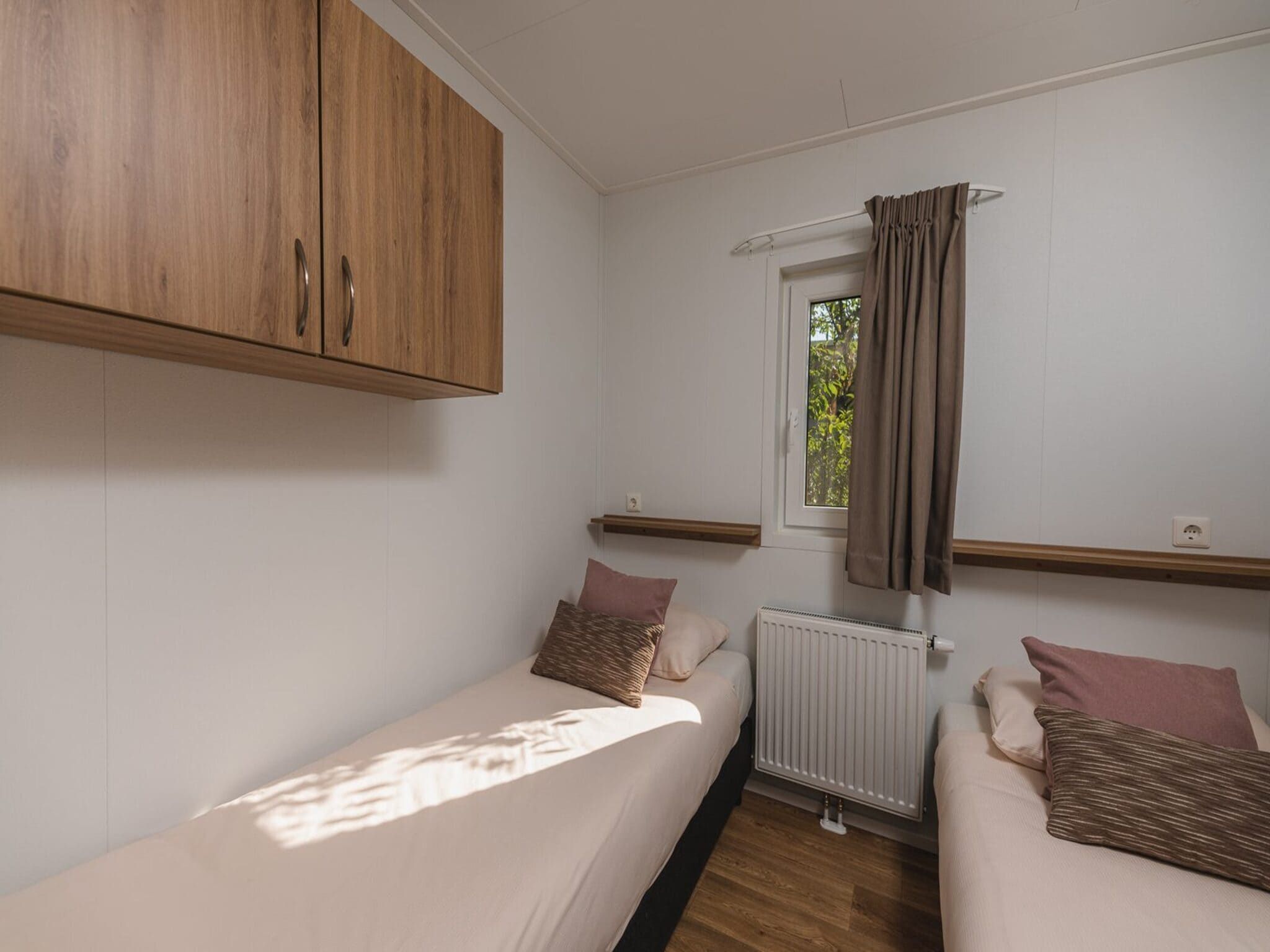 Een slaapkamer van Vakantiepark Mölke 25 in Zuna