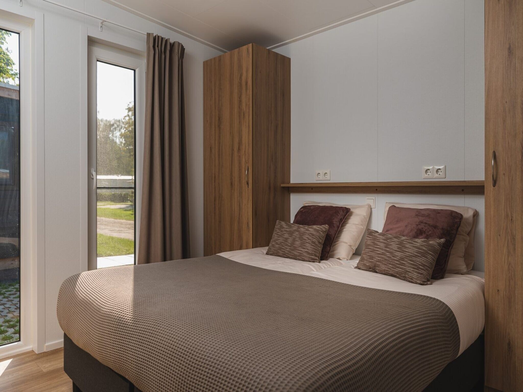 Een slaapkamer van Vakantiepark Mölke 25 in Zuna