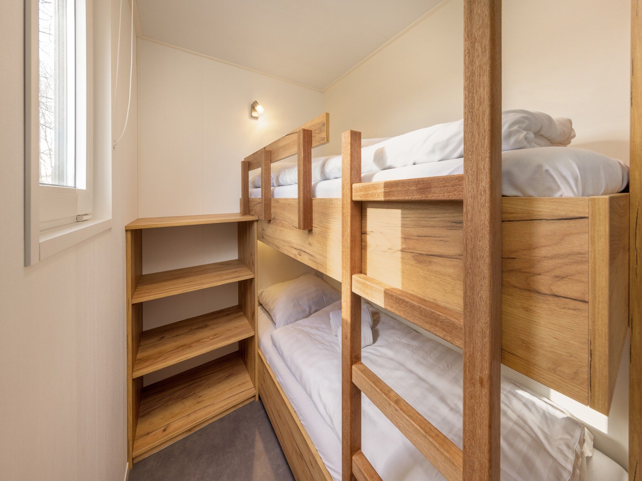 Een slaapkamer van Hunzepark 13 in Gasselternijveen