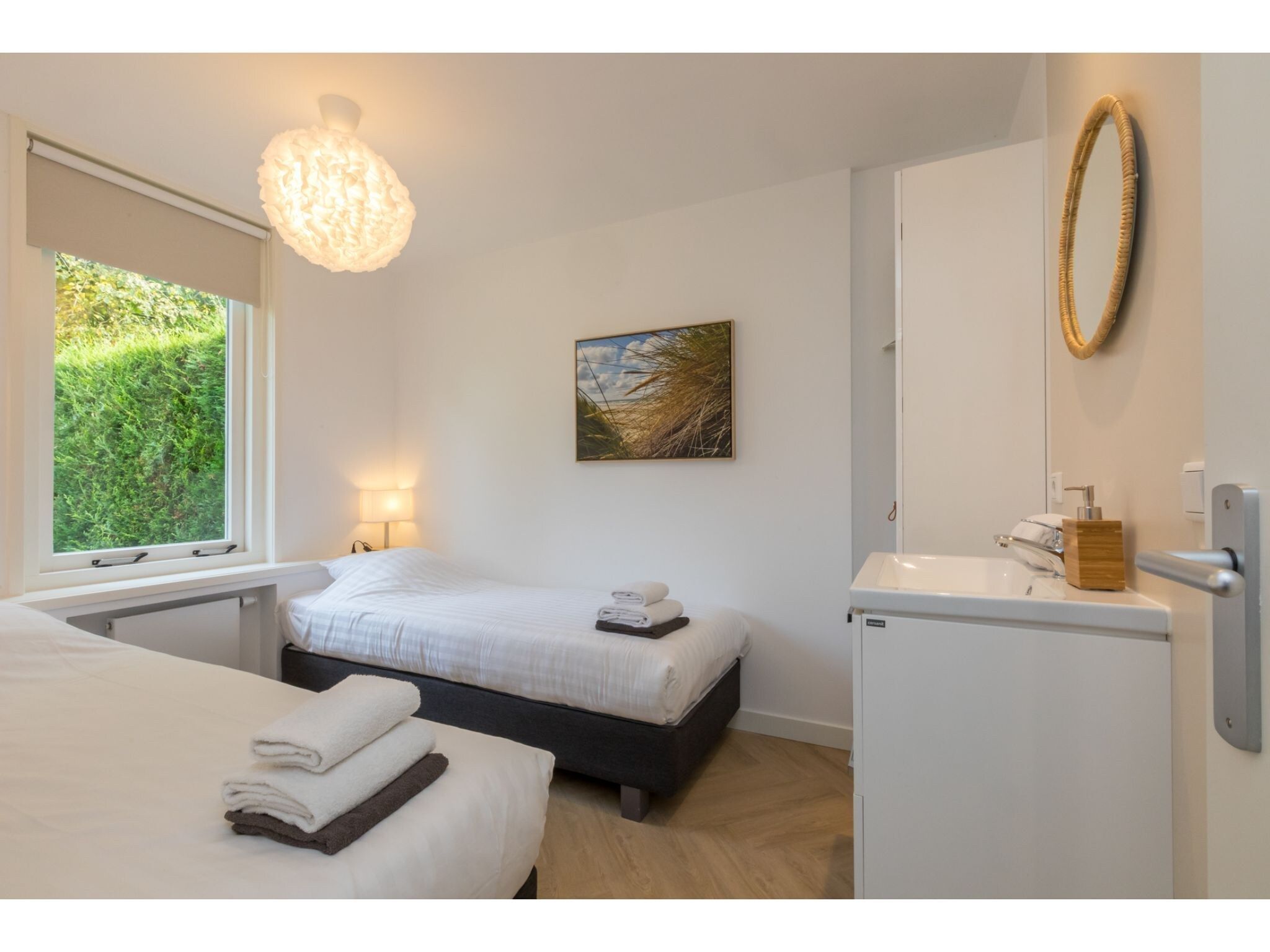 Een slaapkamer van Oosterpark 76 - Oostkapelle in Oostkapelle