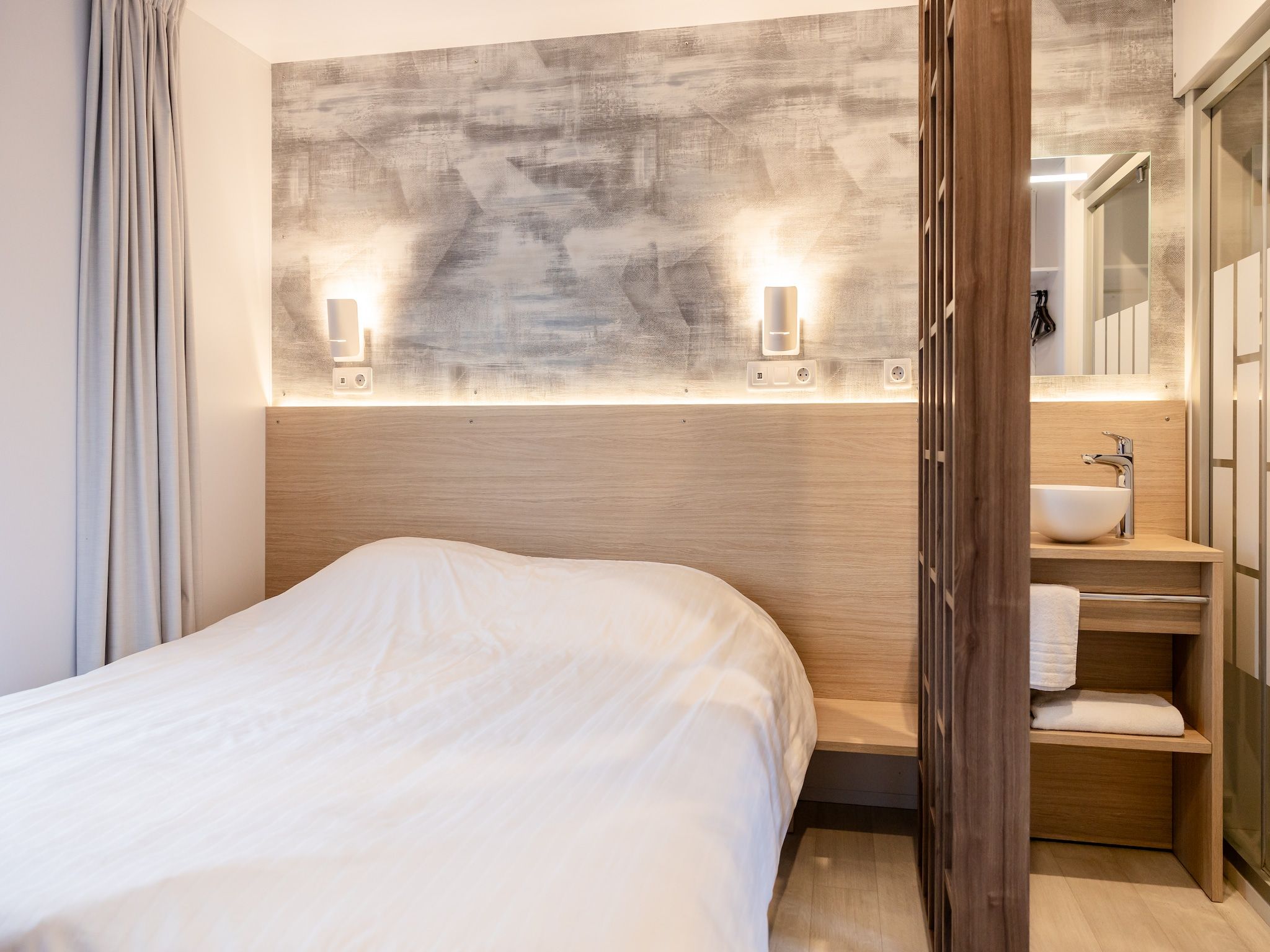 Een slaapkamer van Chalet Imke in De Veenhoop