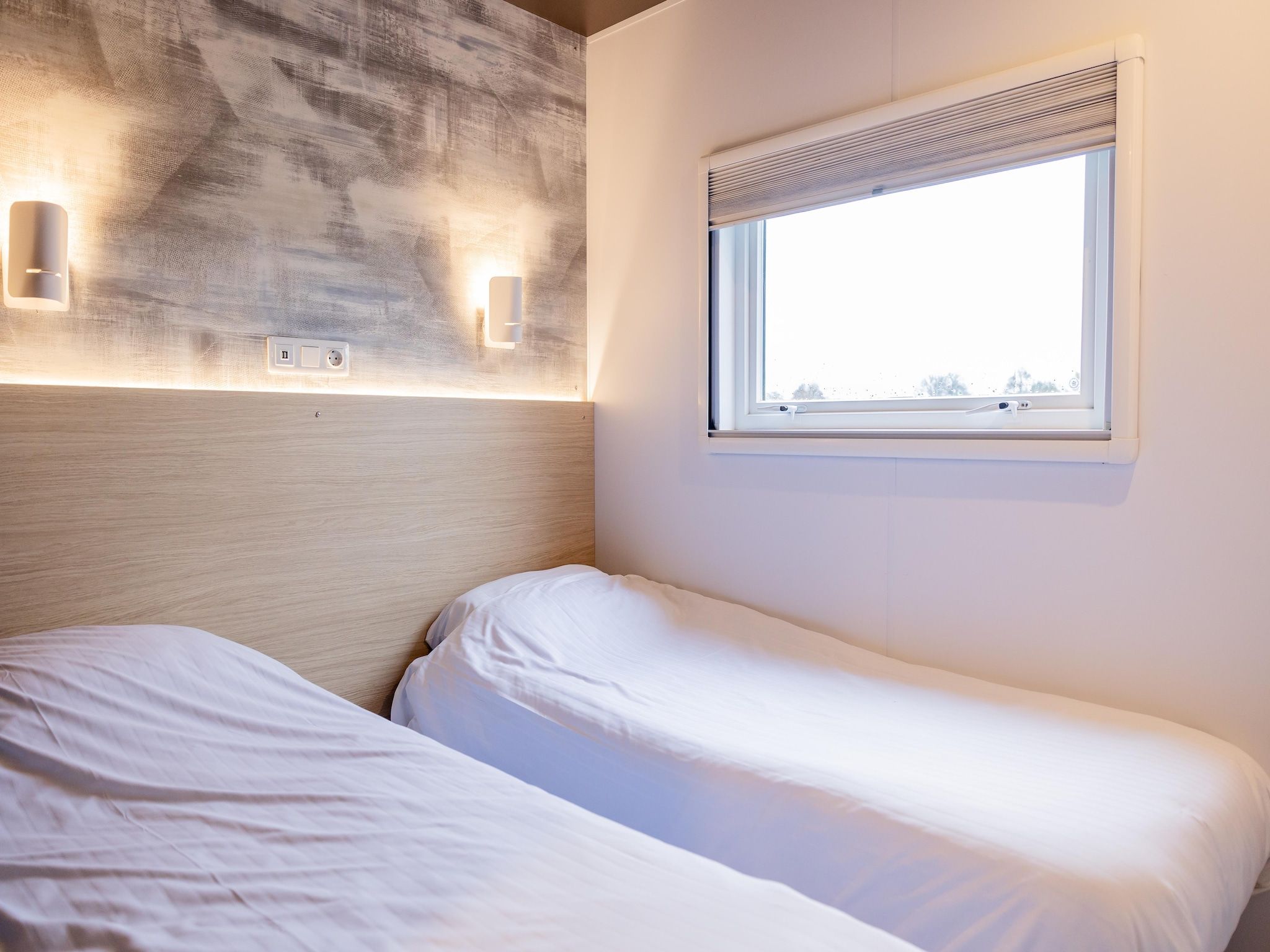 Een slaapkamer van Chalet Imke in De Veenhoop