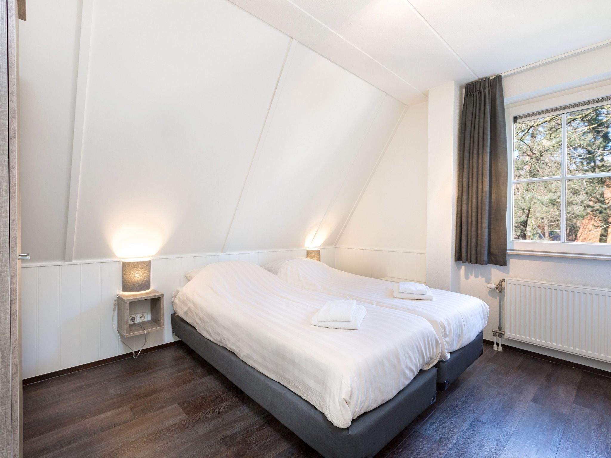 Een slaapkamer van Vakantiepark de Katjeskelder 14 in Oosterhout