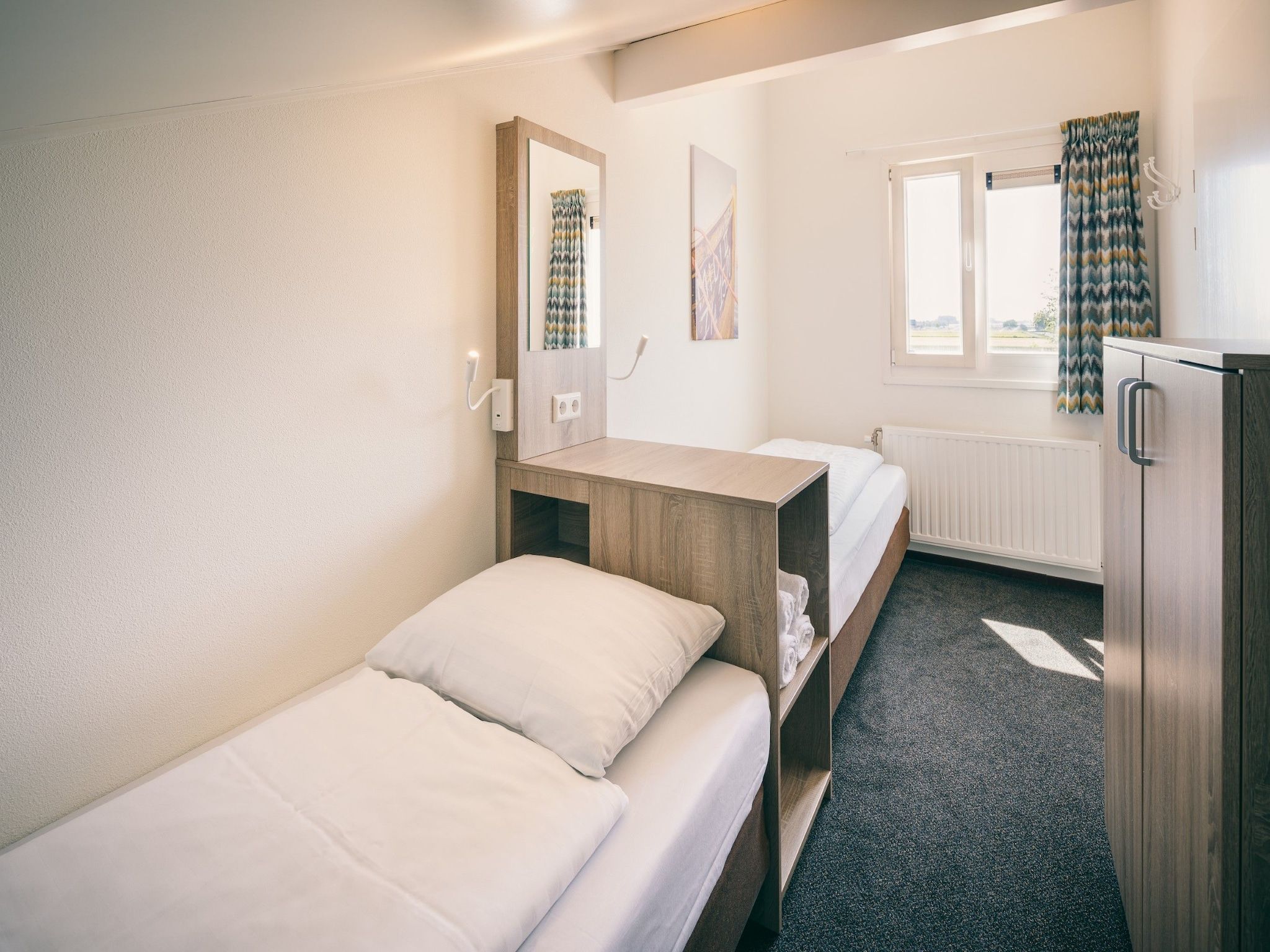 Een slaapkamer van Duinresort Dunimar 2 in Noordwijkerhout