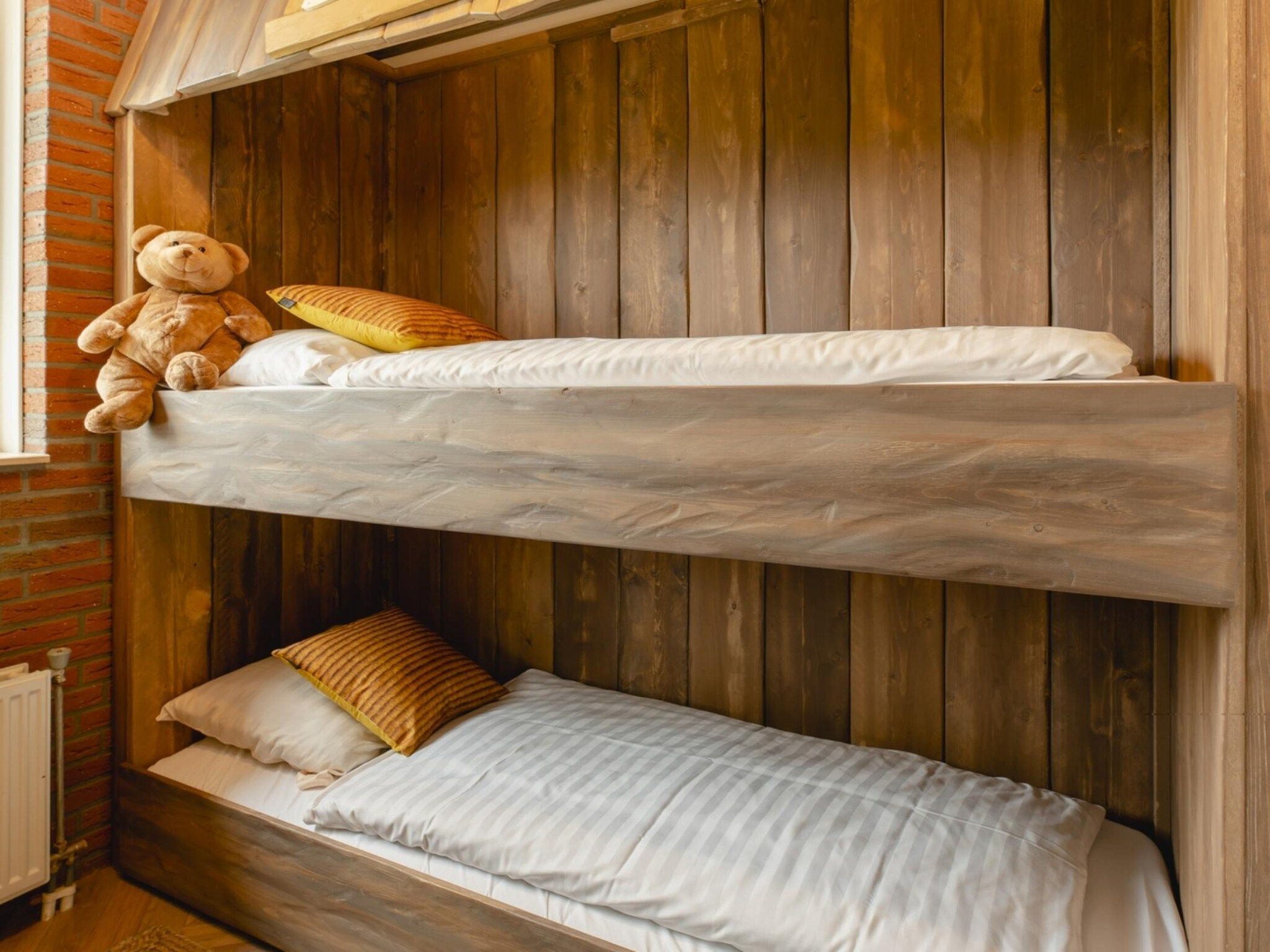 Een slaapkamer van Vakantiepark Mölke 18 in Zuna