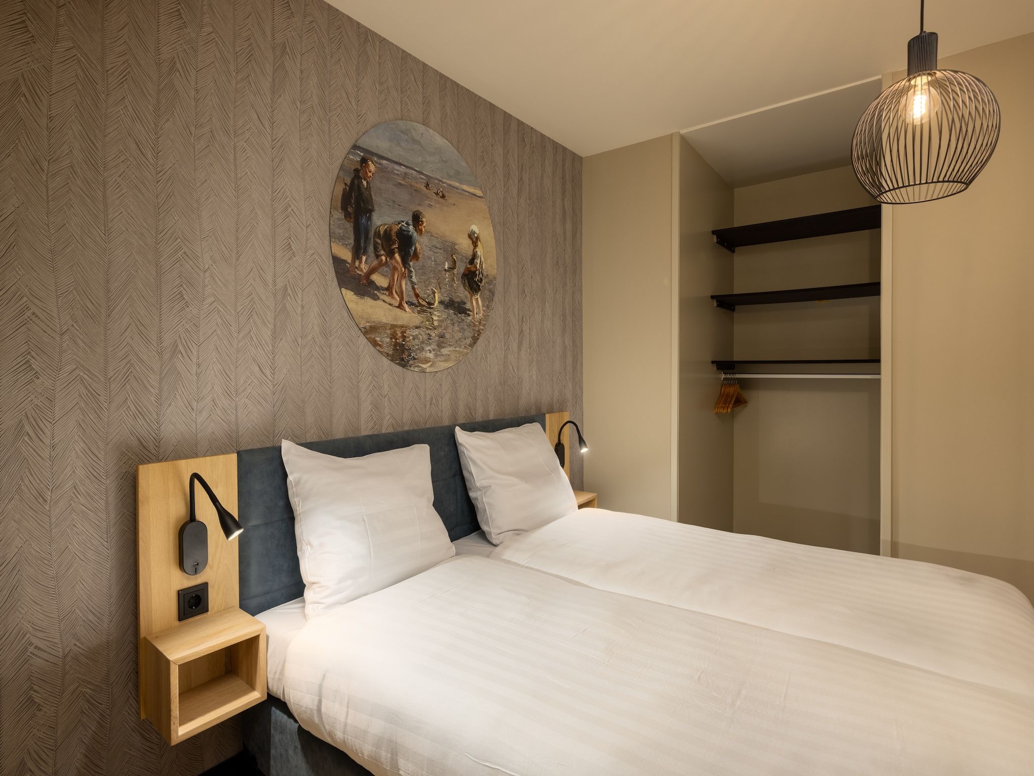 Een slaapkamer van Residentie de Graaf van Egmont 10 in Egmond aan zee