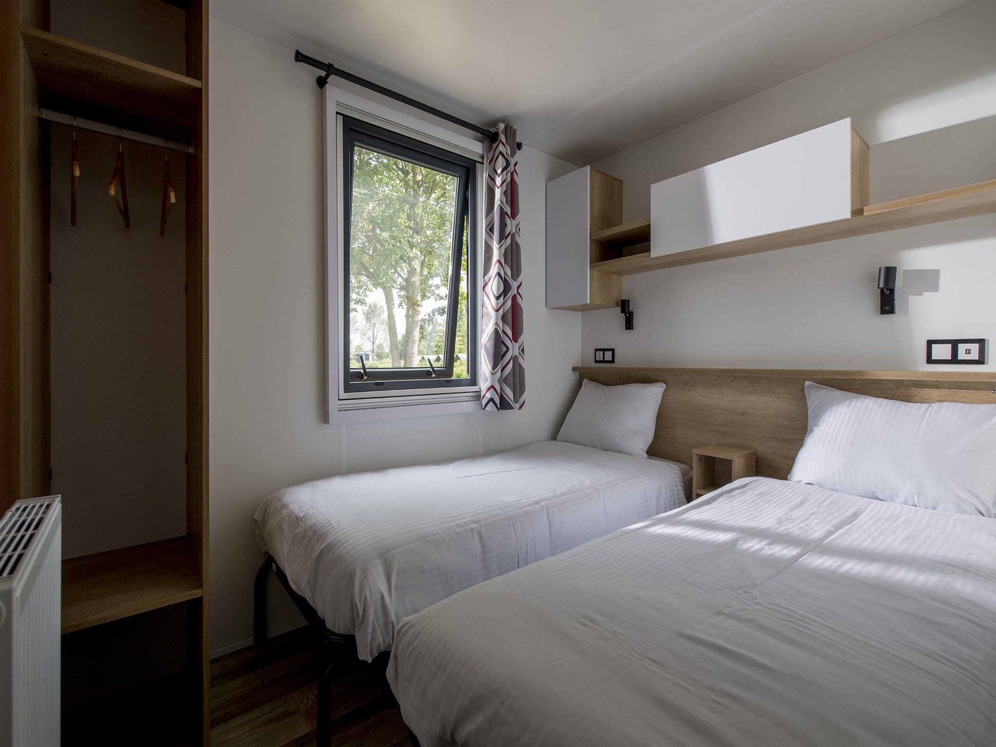 Een slaapkamer van Vakantiepark Eiland van Maurik 7 in Maurik