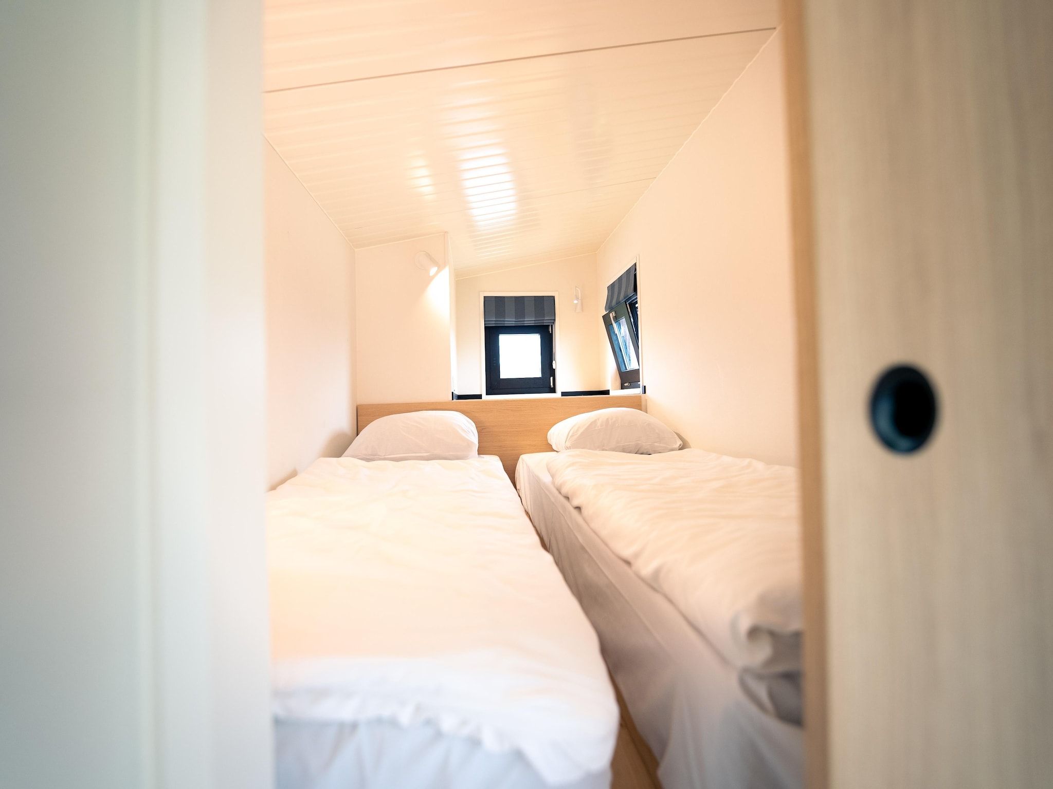 Een slaapkamer van Resort Callantsoog 4 in Callantsoog