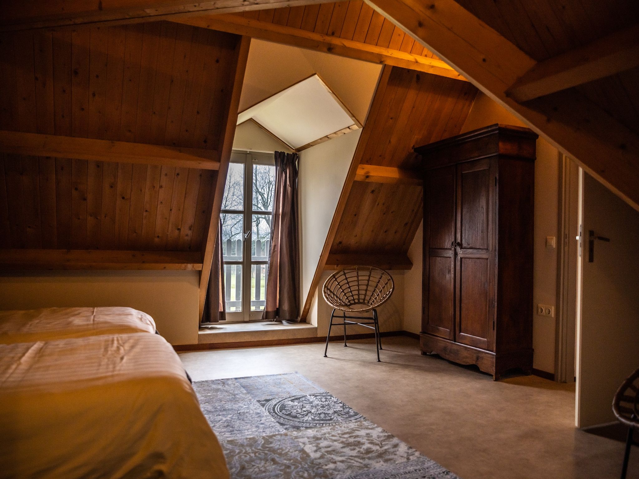 Een slaapkamer van Vakantiewoning - Oranjezon 4p in Vrouwenpolder