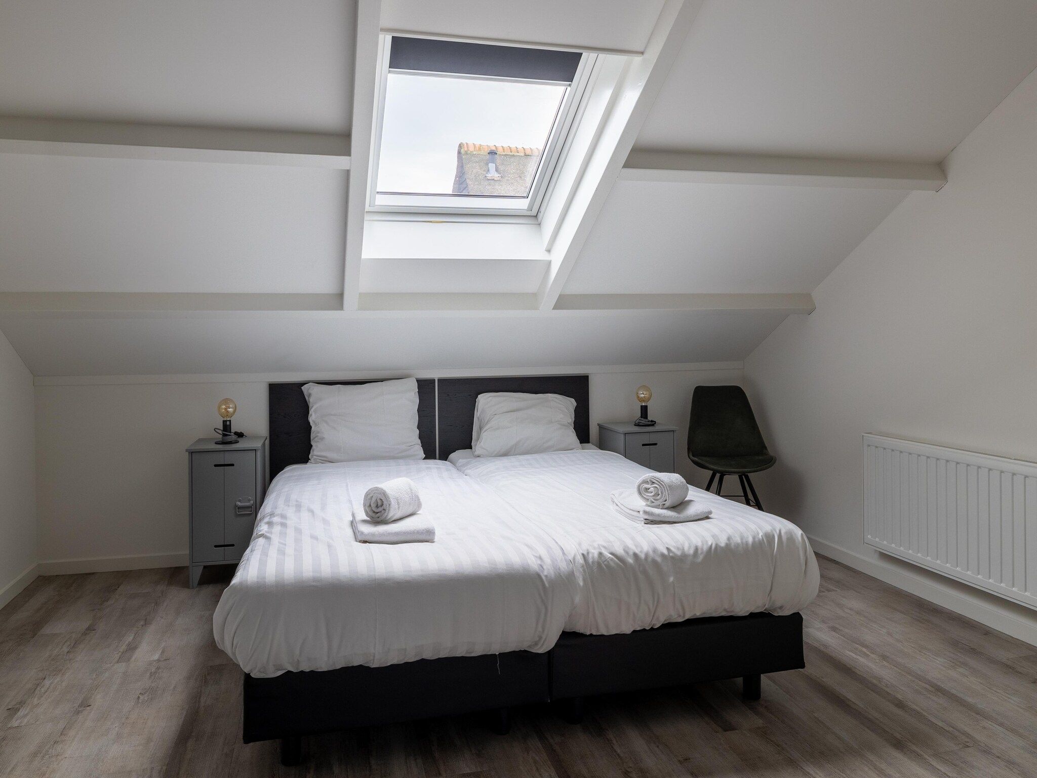 Een slaapkamer van Oranjezon app 6p in Vrouwenpolder