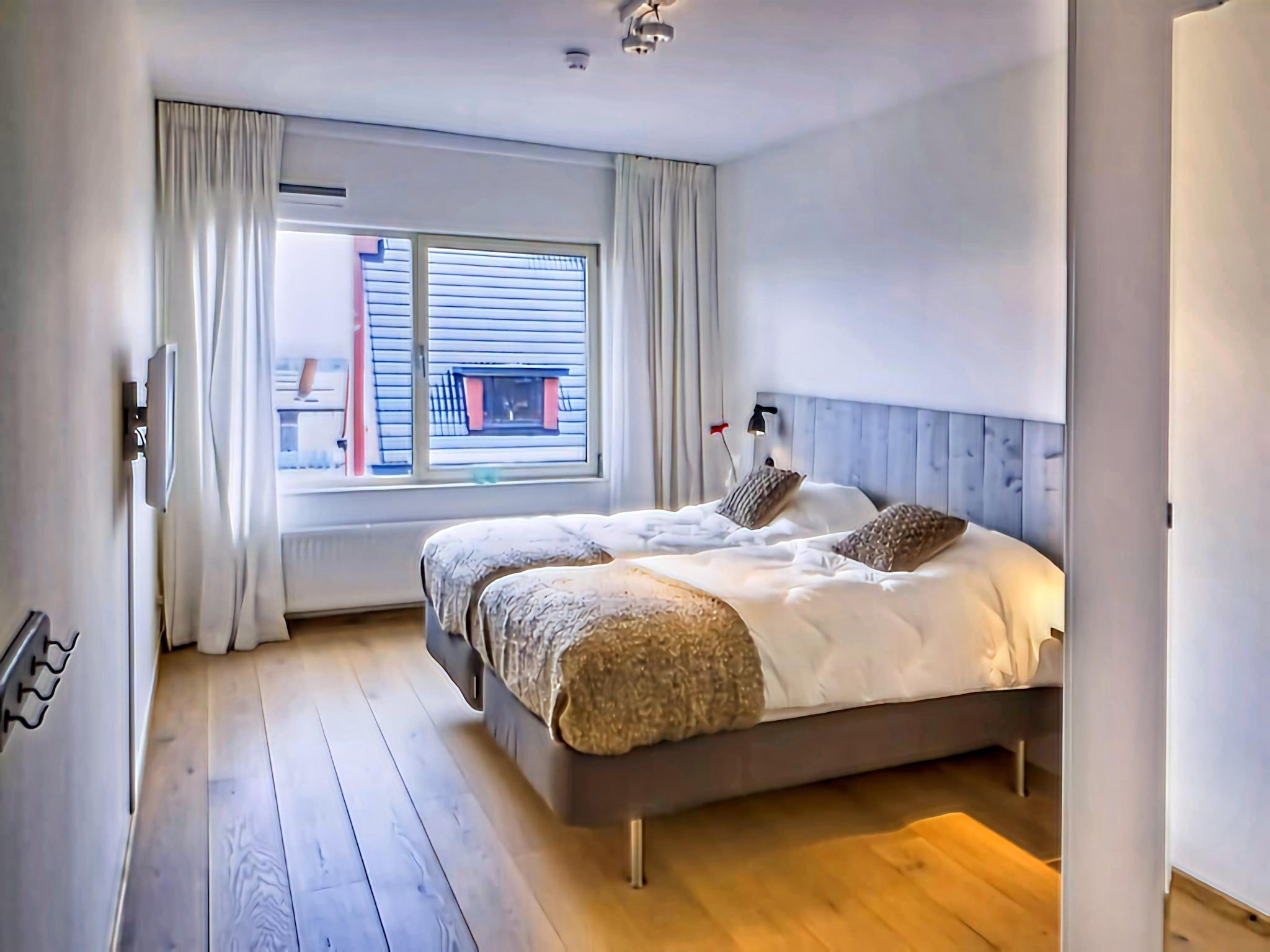 Een slaapkamer van Scheveningen Harbour 10B in Den Haag