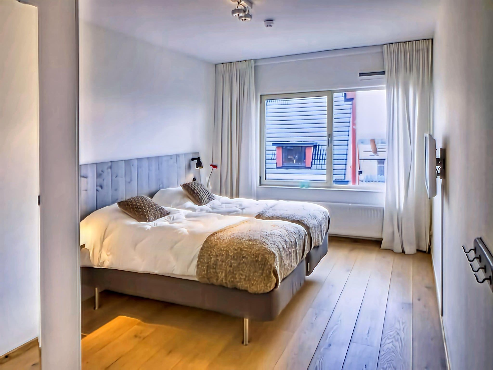 Een slaapkamer van Scheveningen Harbour 10B in Den Haag