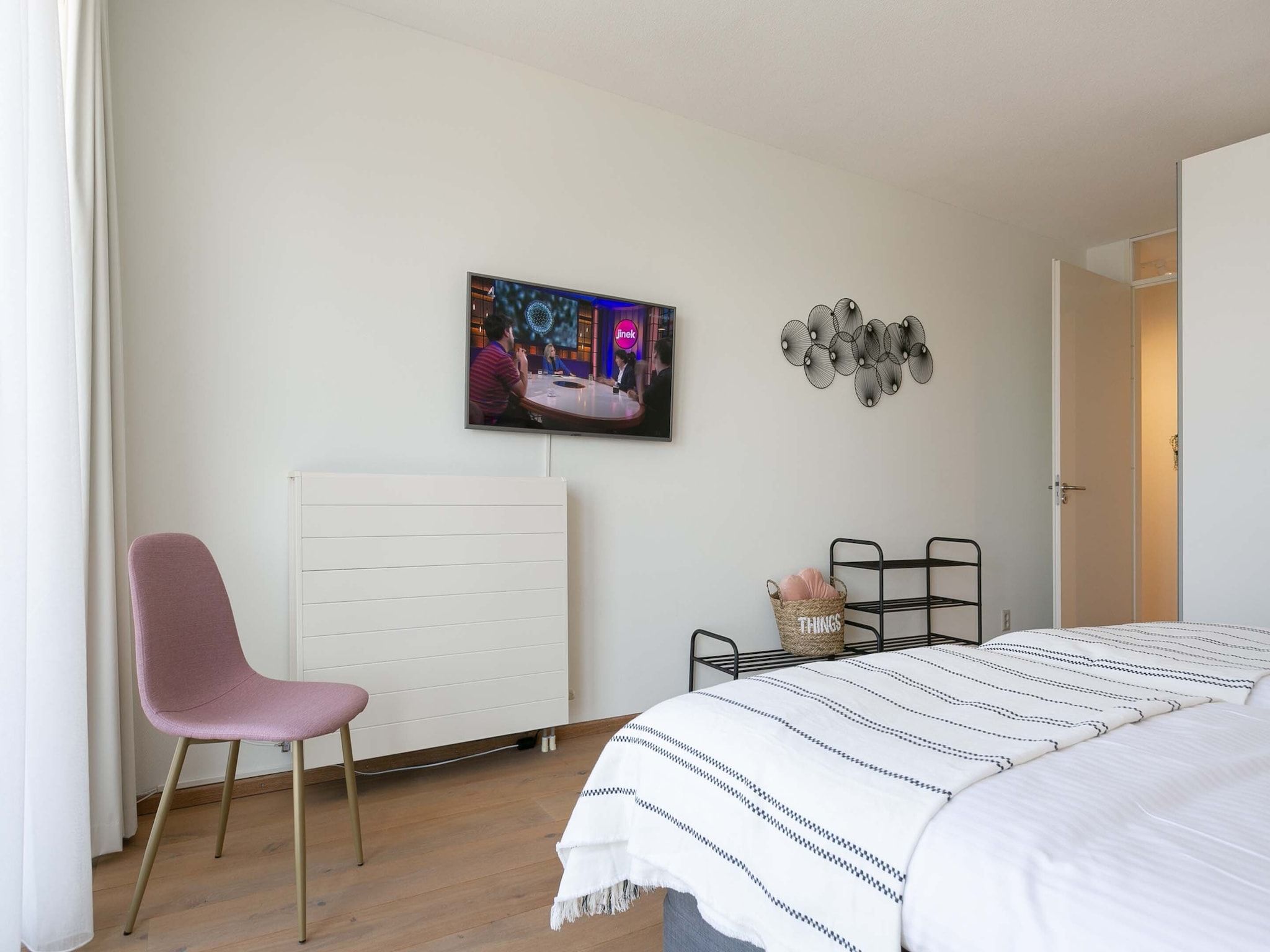 Een slaapkamer van Scheveningen Harbour 28 in Den Haag