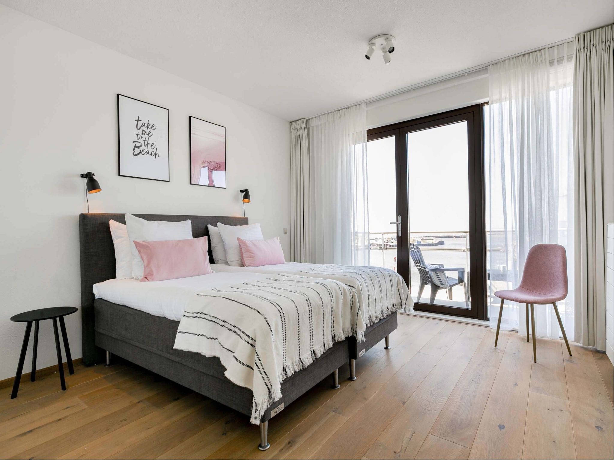 Een slaapkamer van Scheveningen Harbour 28 in Den Haag