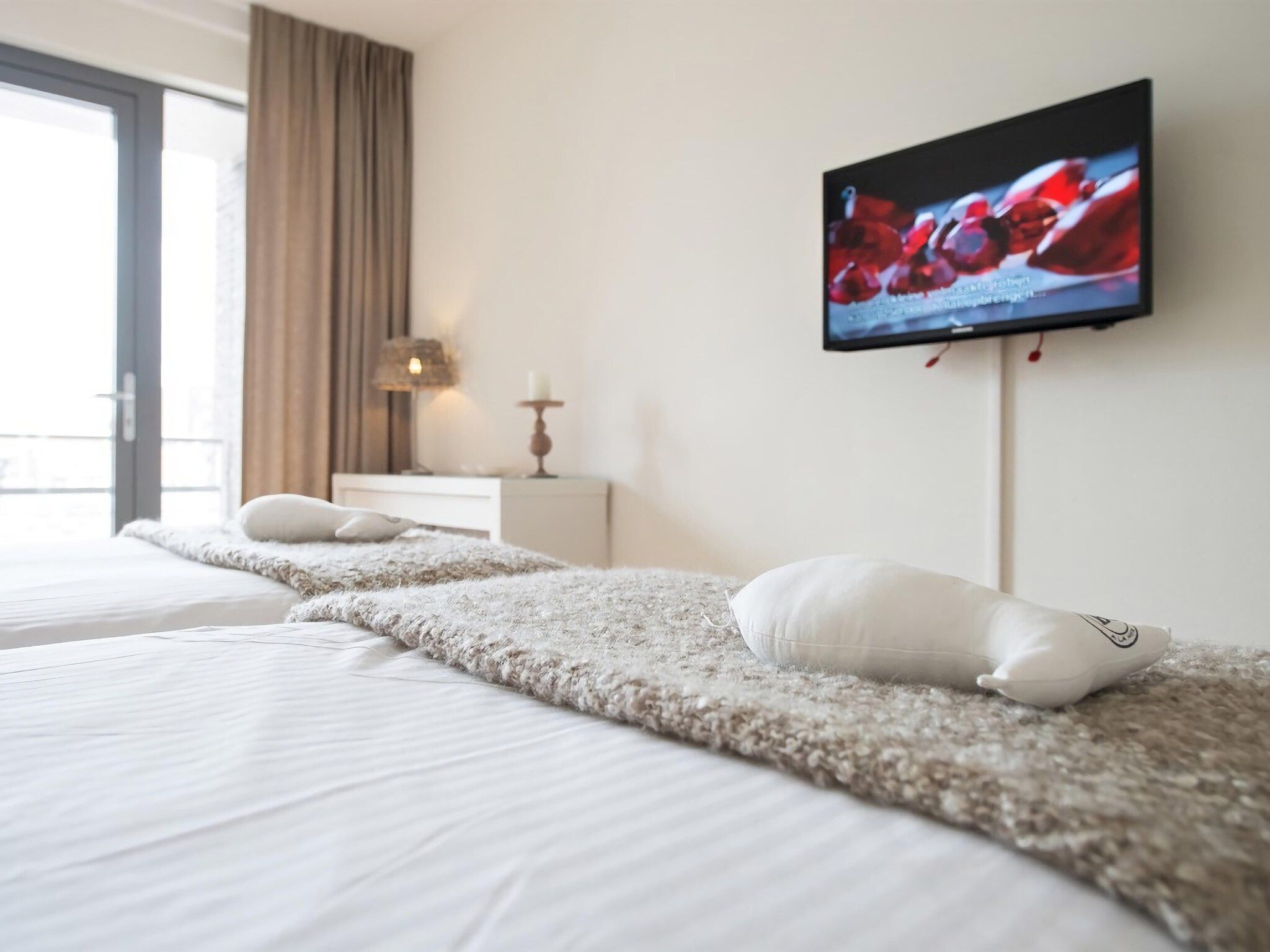 Een slaapkamer van Scheveningen Harbour 22B in Den Haag