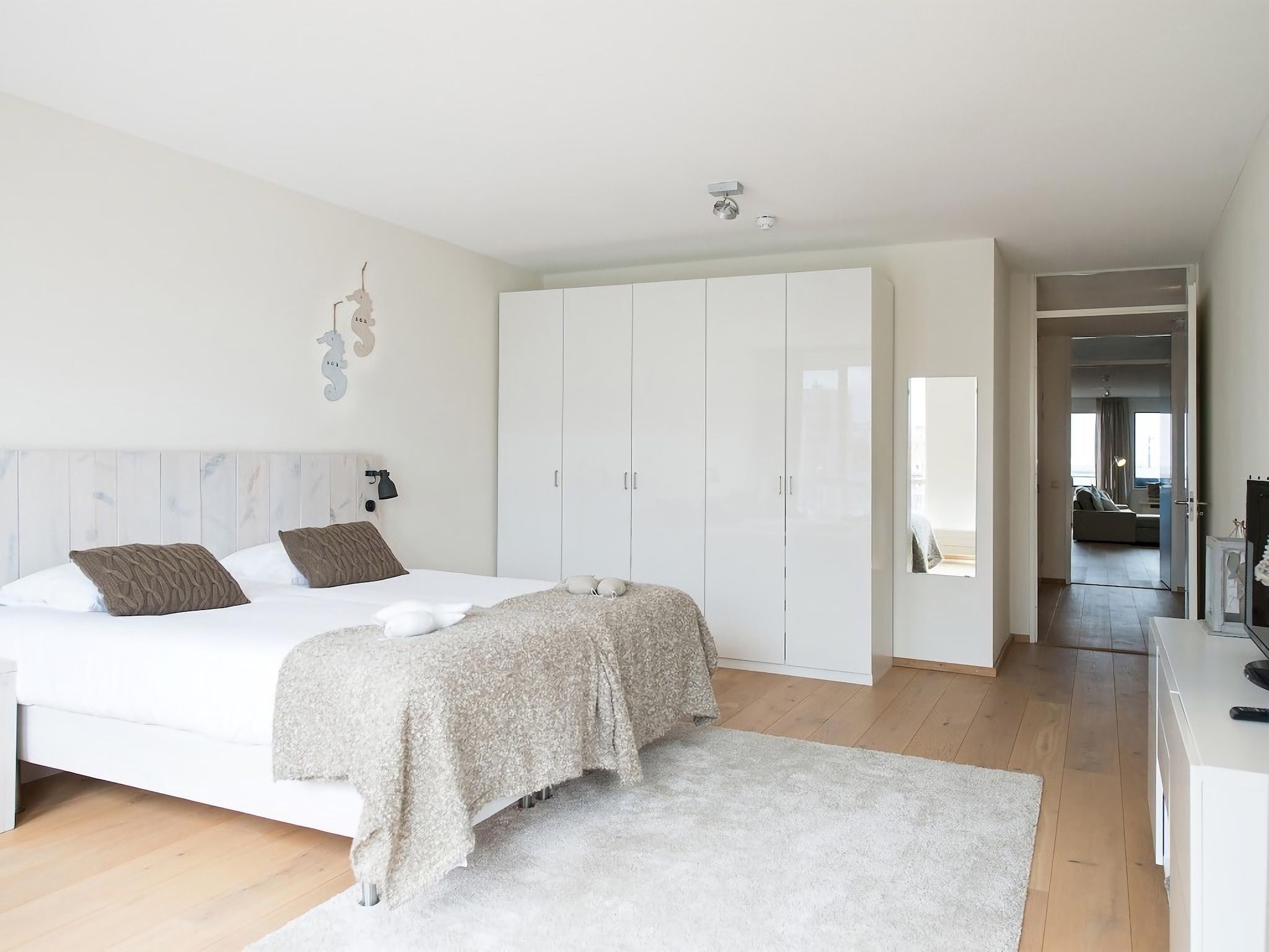 Een slaapkamer van Scheveningen Harbour 22B in Den Haag