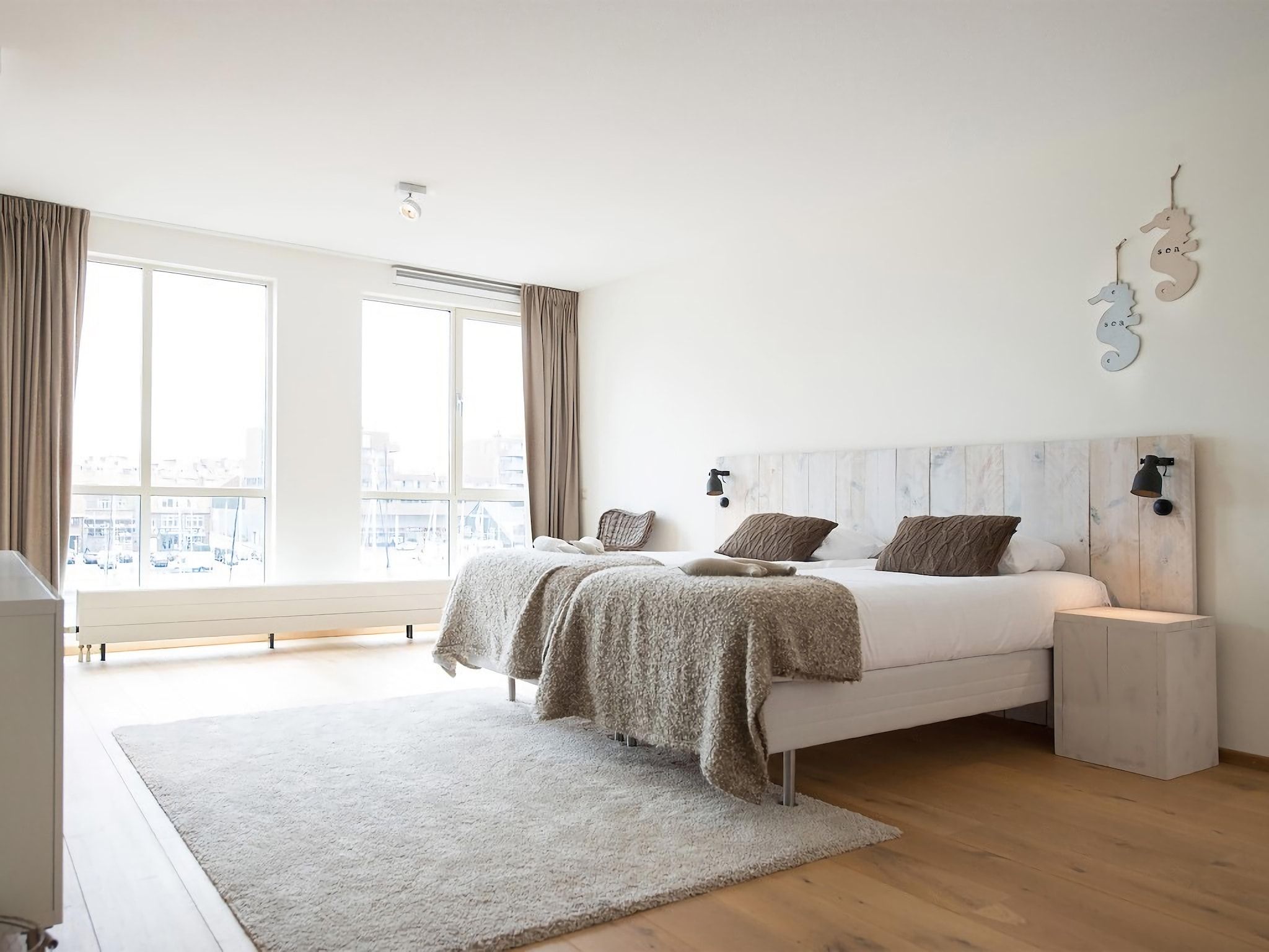 Een slaapkamer van Scheveningen Harbour 22B in Den Haag