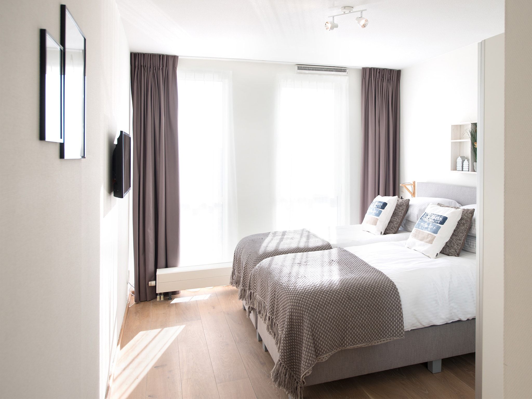 Een slaapkamer van Scheveningen Harbour 28B in Den Haag