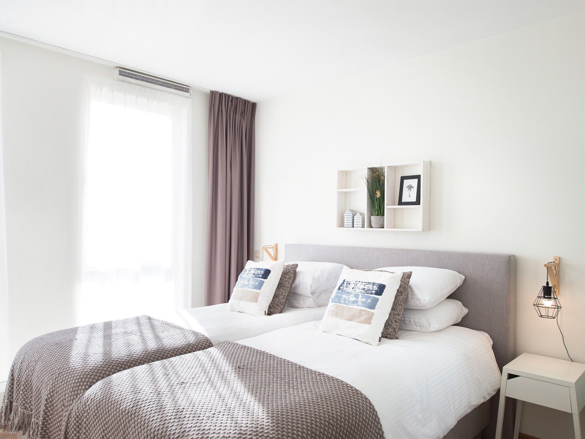 Een slaapkamer van Scheveningen Harbour 28B in Den Haag