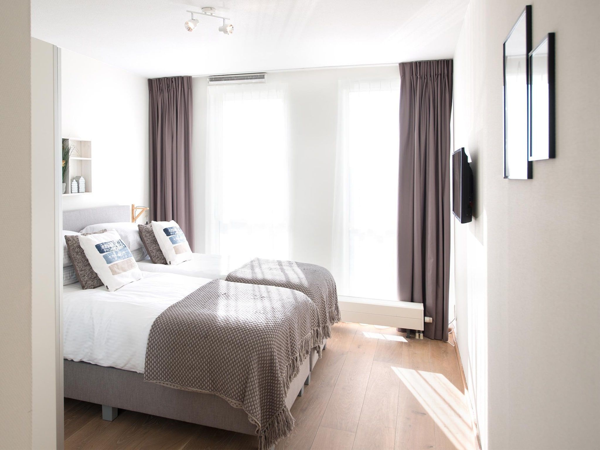 Een slaapkamer van Scheveningen Harbour 28B in Den Haag
