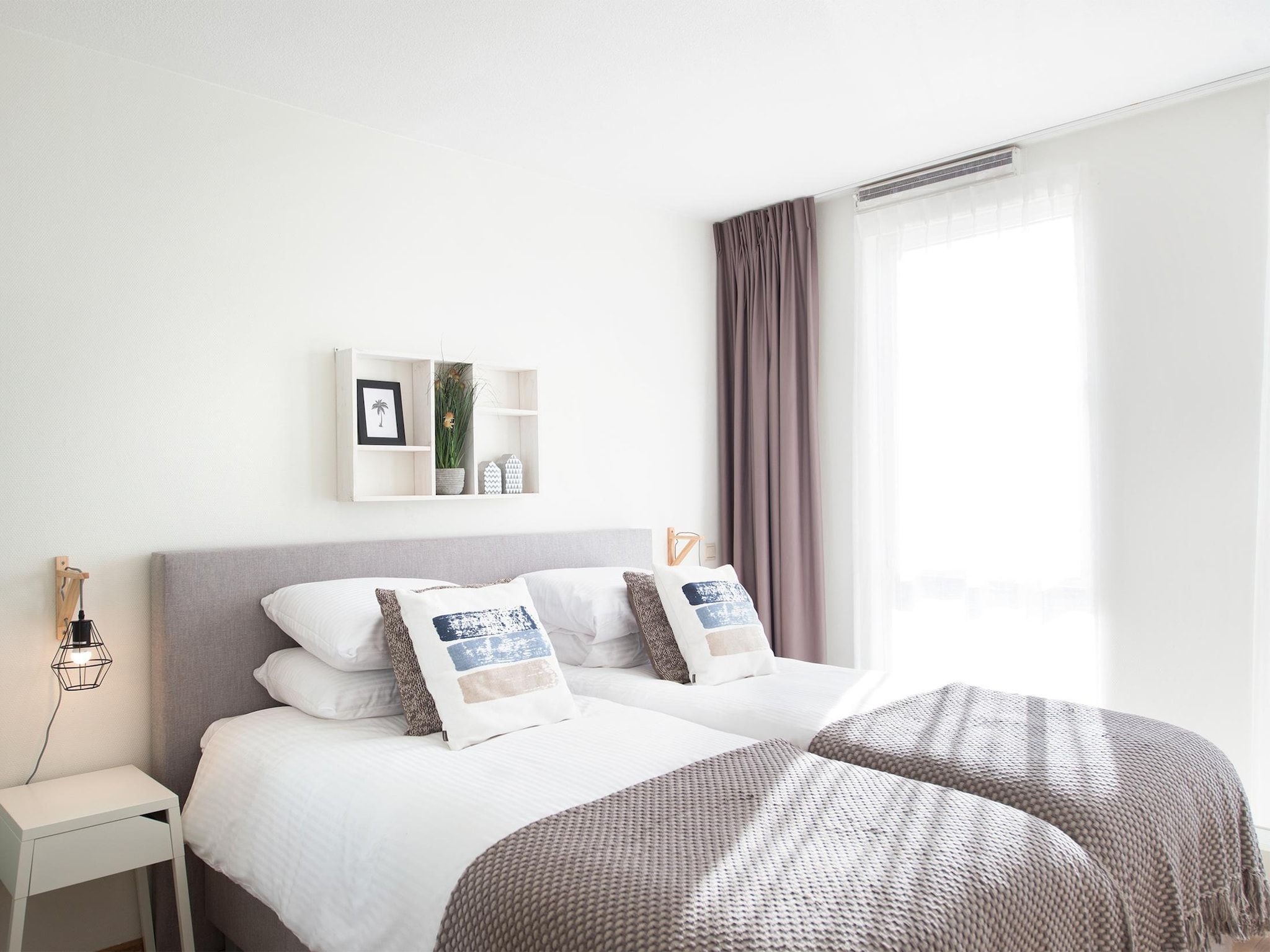 Een slaapkamer van Scheveningen Harbour 28B in Den Haag