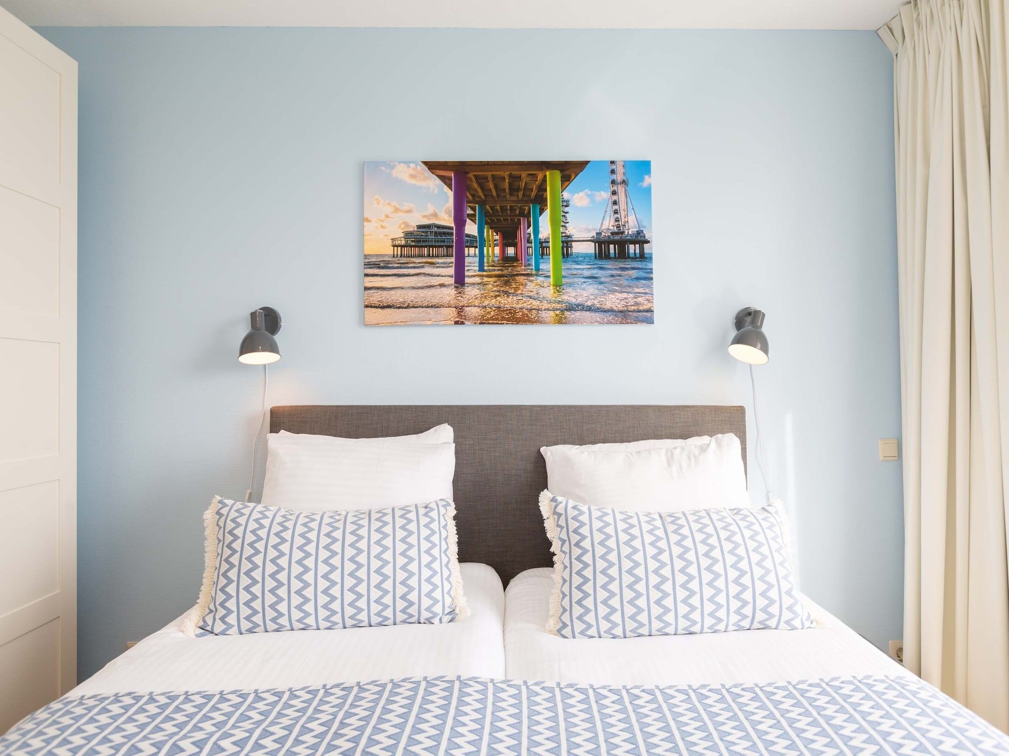Een slaapkamer van Scheveningen Harbour 28C in Den Haag
