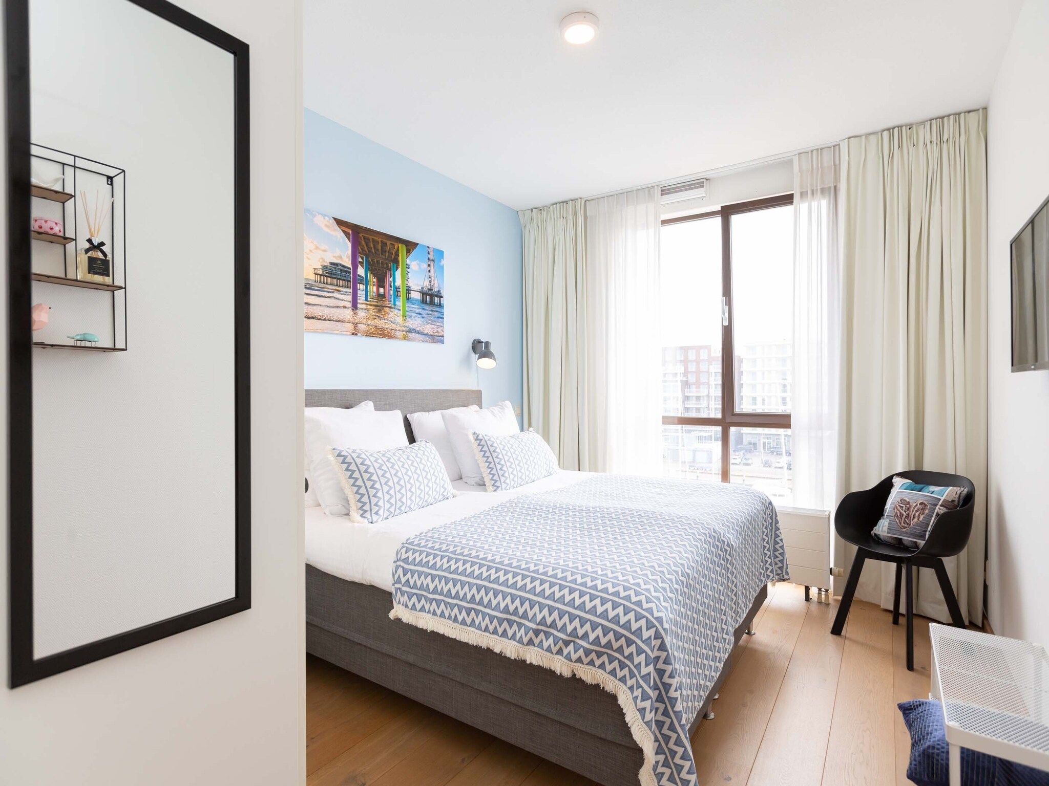 Een slaapkamer van Scheveningen Harbour 28C in Den Haag
