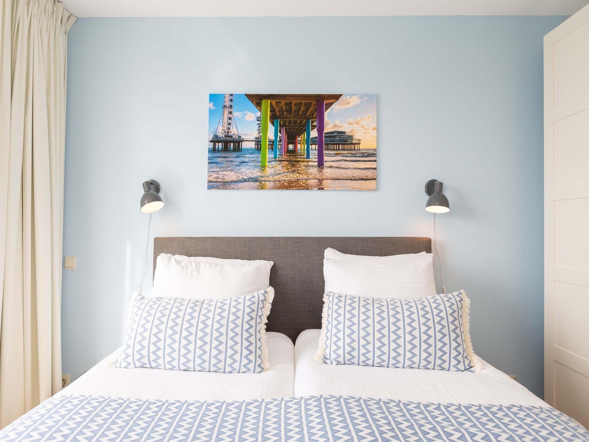 Een slaapkamer van Scheveningen Harbour 28C in Den Haag
